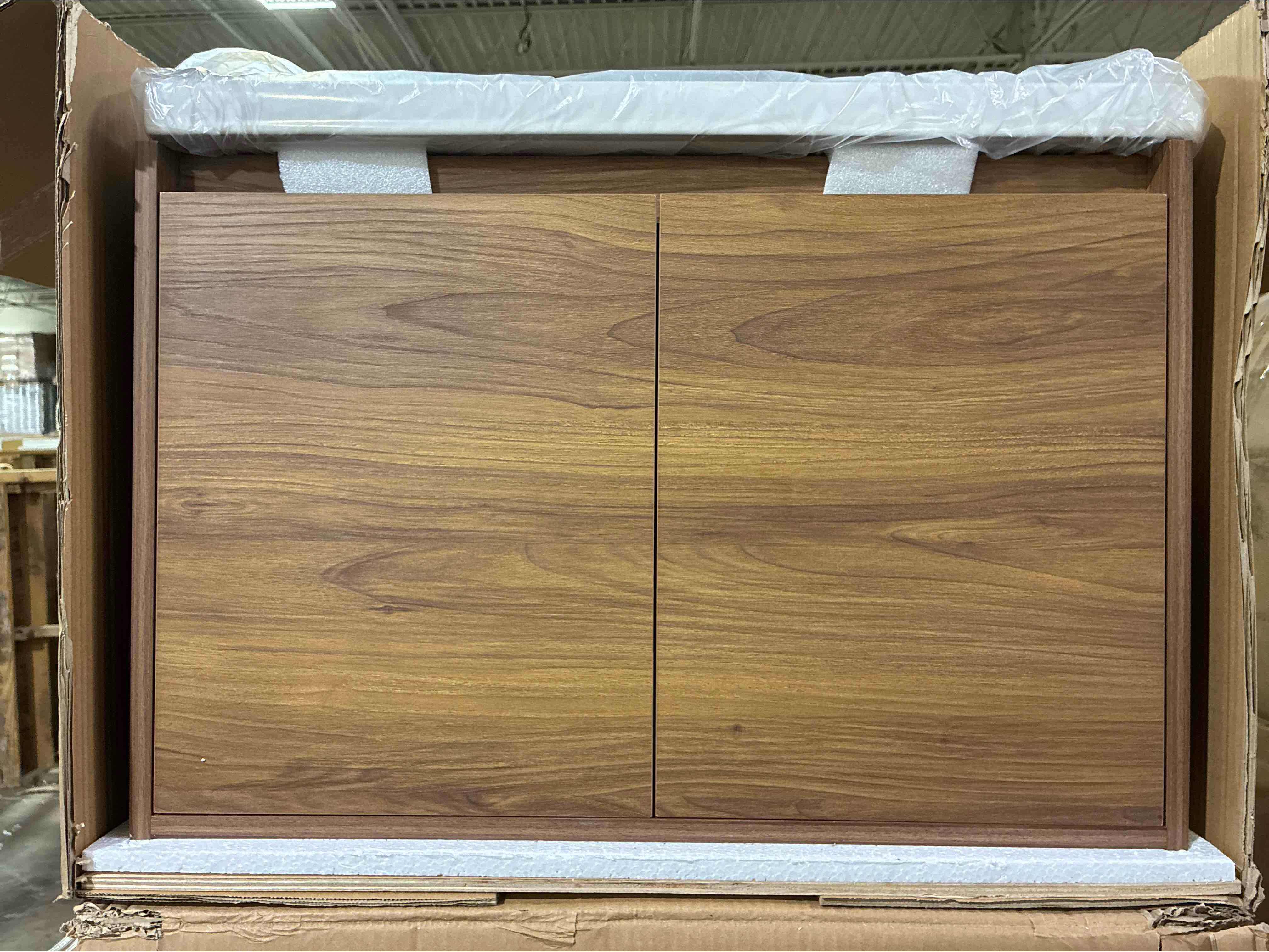 Condition photo showing New/Like New for blossom 28 inch brown walnut wood wall mounted single bathroom vanity with white ceramic sink and 2 soft close doors. 27.75 in. w x 19.88 in. h x 18.5 in. d