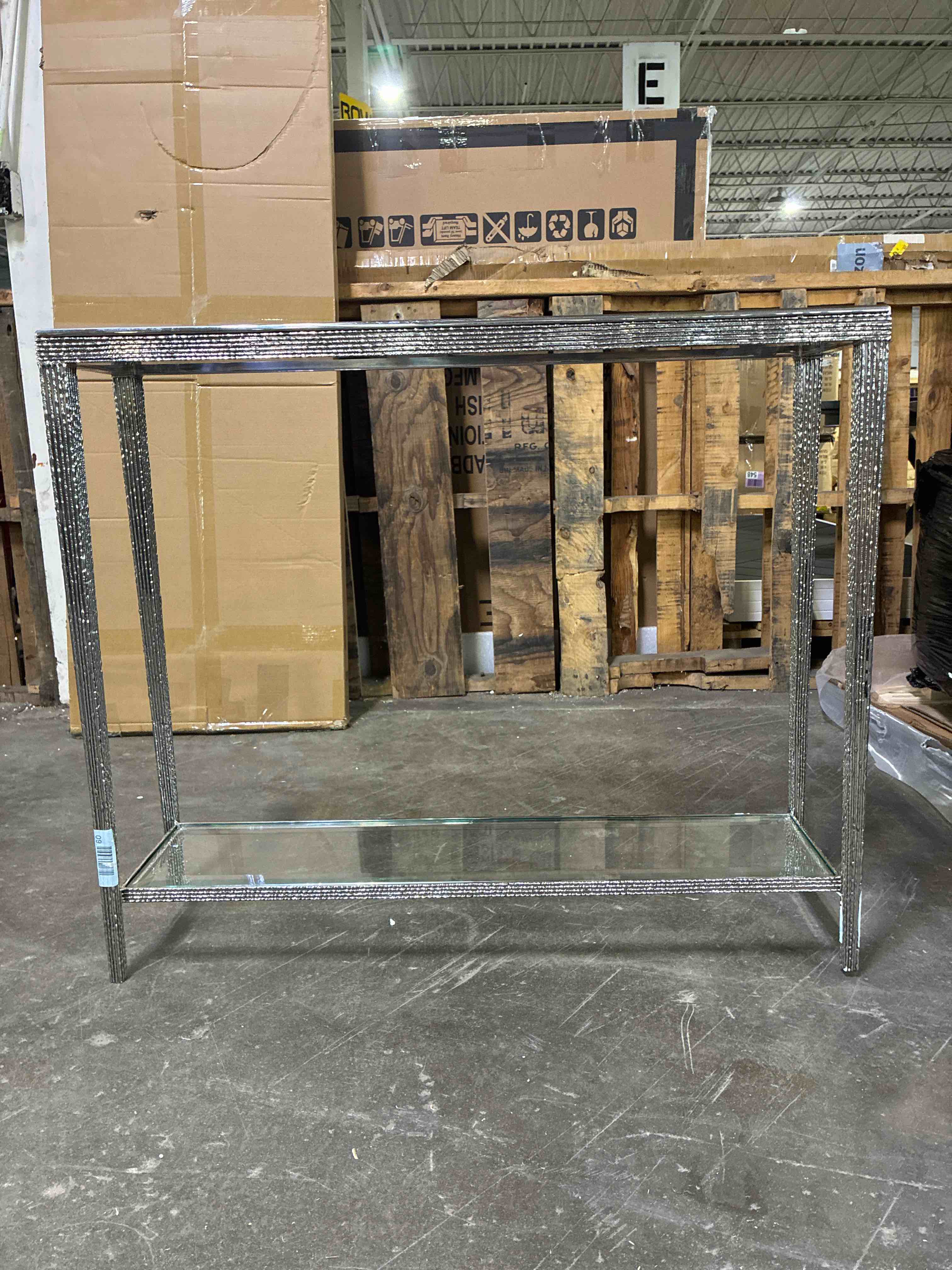 Condition photo showing New/Like New for jinx 38'' thin hand designed nickel framed 2 tier console table with glass tops. slightly wobbly, otherwise pristine condition, is considered brand new. 32'' h x 38'' w x 10'' d