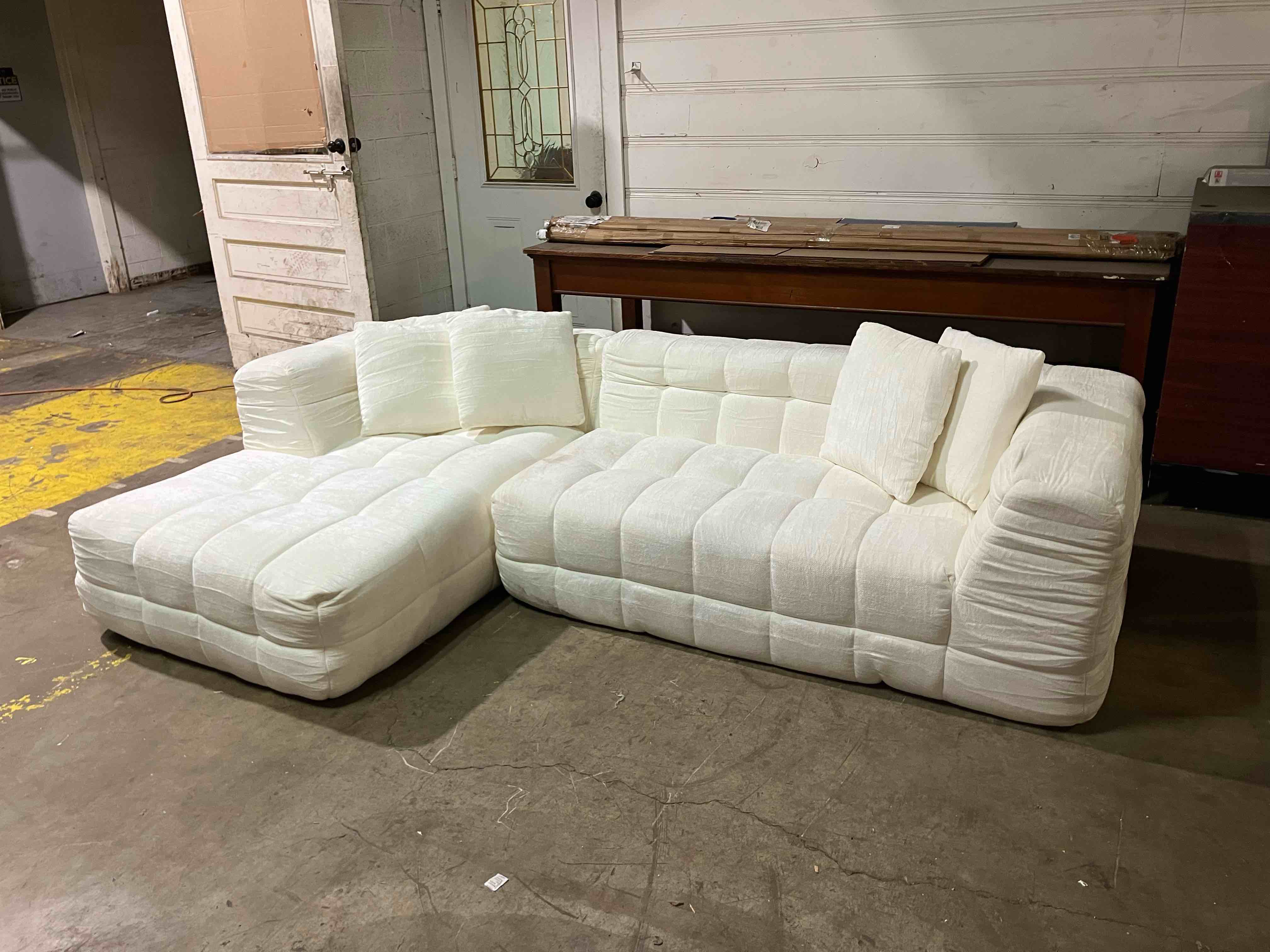 Condition photo showing Good Condition for 120" Boneless-Couch L-Shaped Sofa for Living Room, Cloud Couch with Chaise Lounge, Sectional Upholstered Chenille Deep Seat Couches with 4 Pillows, No Assembly Required, Beige - (Good condition because of a zipper malfunction underneath sofa. It also has some dirty spots that will need cleaned, pictured)