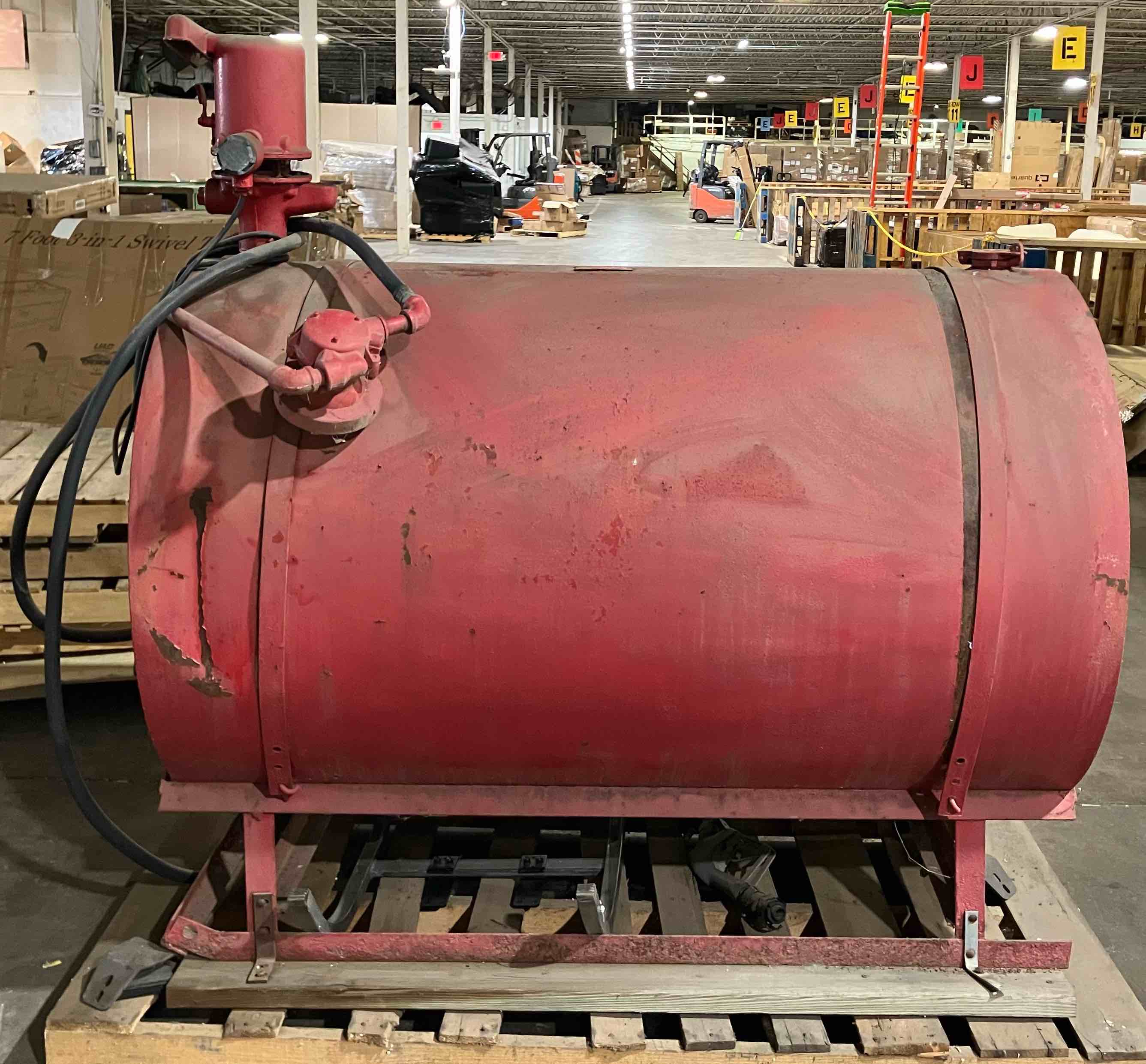 300 gallon (estimated capacity) fuel tank with Marathon Electric 1/4 HP, 115v 1725rpm pump and nozzle - diesel/oil transfer setup - (As is because tank has rust and internal condition of tank is unknown)
