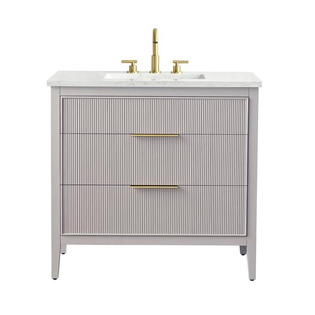 emma 36 in. w taupe grey single bath vanity sink with 2 drawers, gold brushed handles, and arabescato stone top. some scratches along the top, minor chip on top edge. product depth (in.) 22.00 in product height (in.) 34 in product width (in.) 36 in