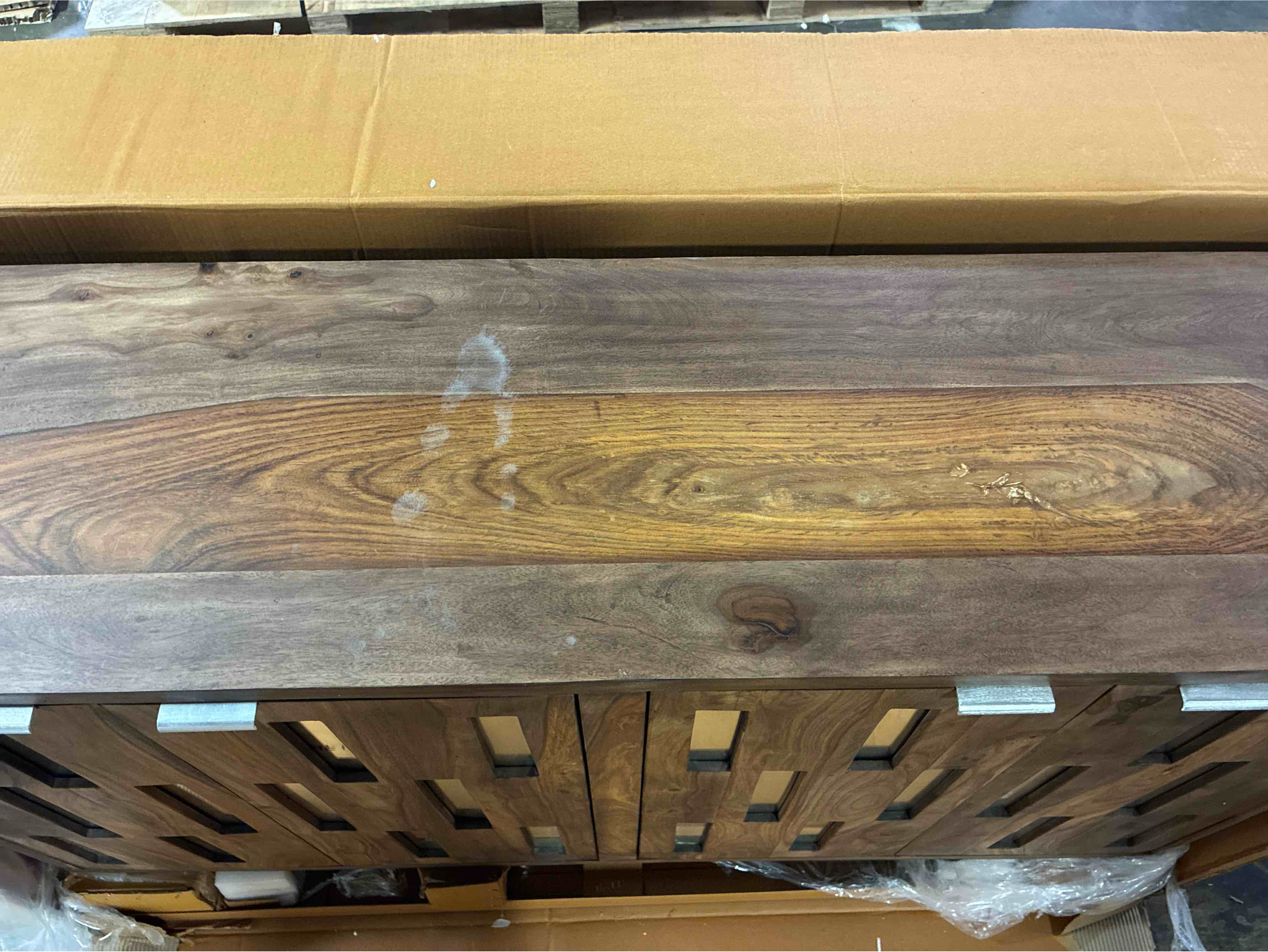 Condition photo showing Good Condition for coast to coast brownstone casual painted sheesham wooden 4 door single shelf console table with mirrored front and distressed nickel handles. minor marks along top otherwise brand new condition.  assembled depth (inches) 16 assembled height (inches) 35 assembled weight (lbs.) 144