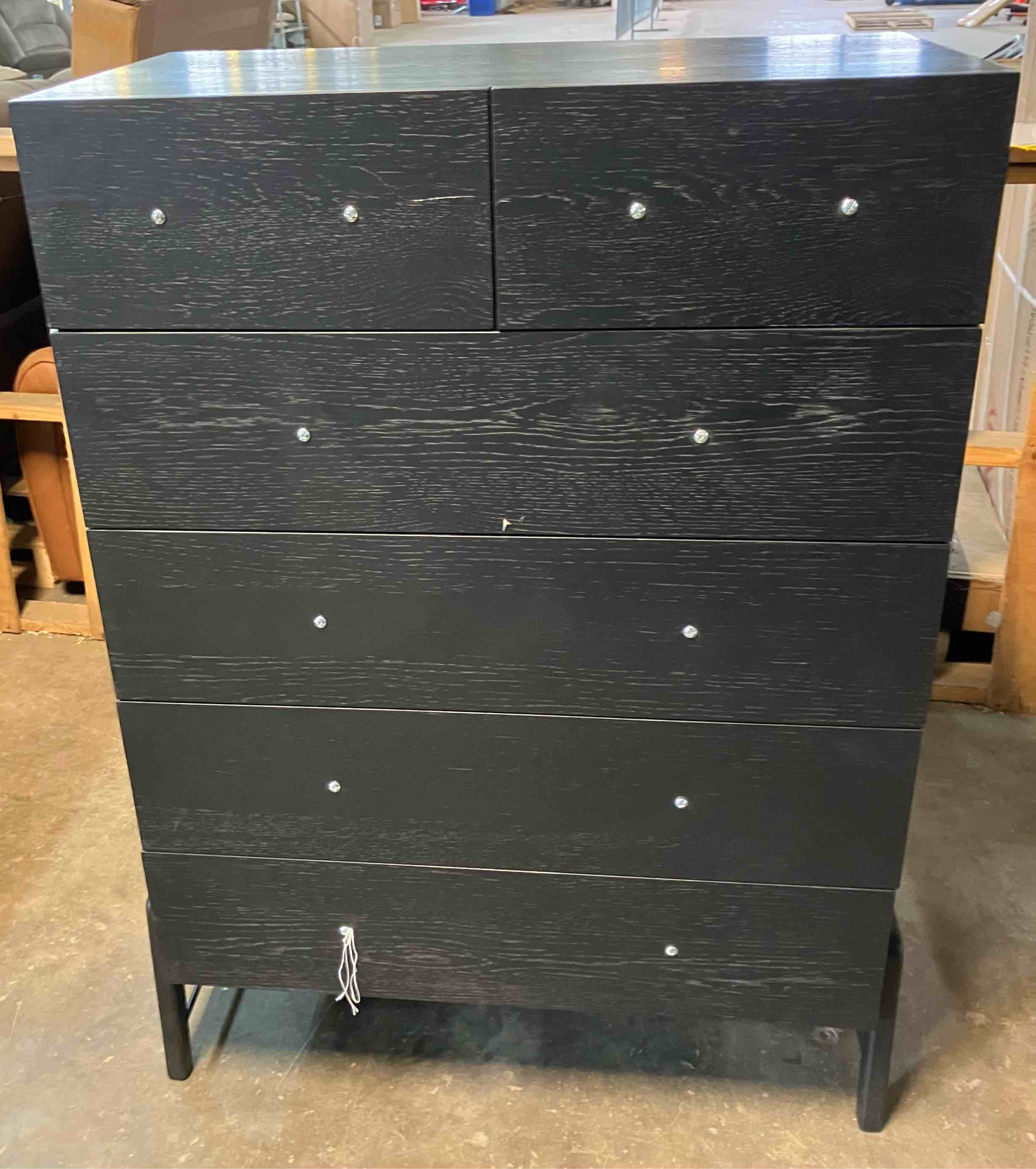 Condition photo showing Good Condition for rosedale ebony oak 6 drawer tall chest - (good condition because of a knick in the wood on a front drawer, pictured, and a dented spot in the wood on the back right side, also pictured)