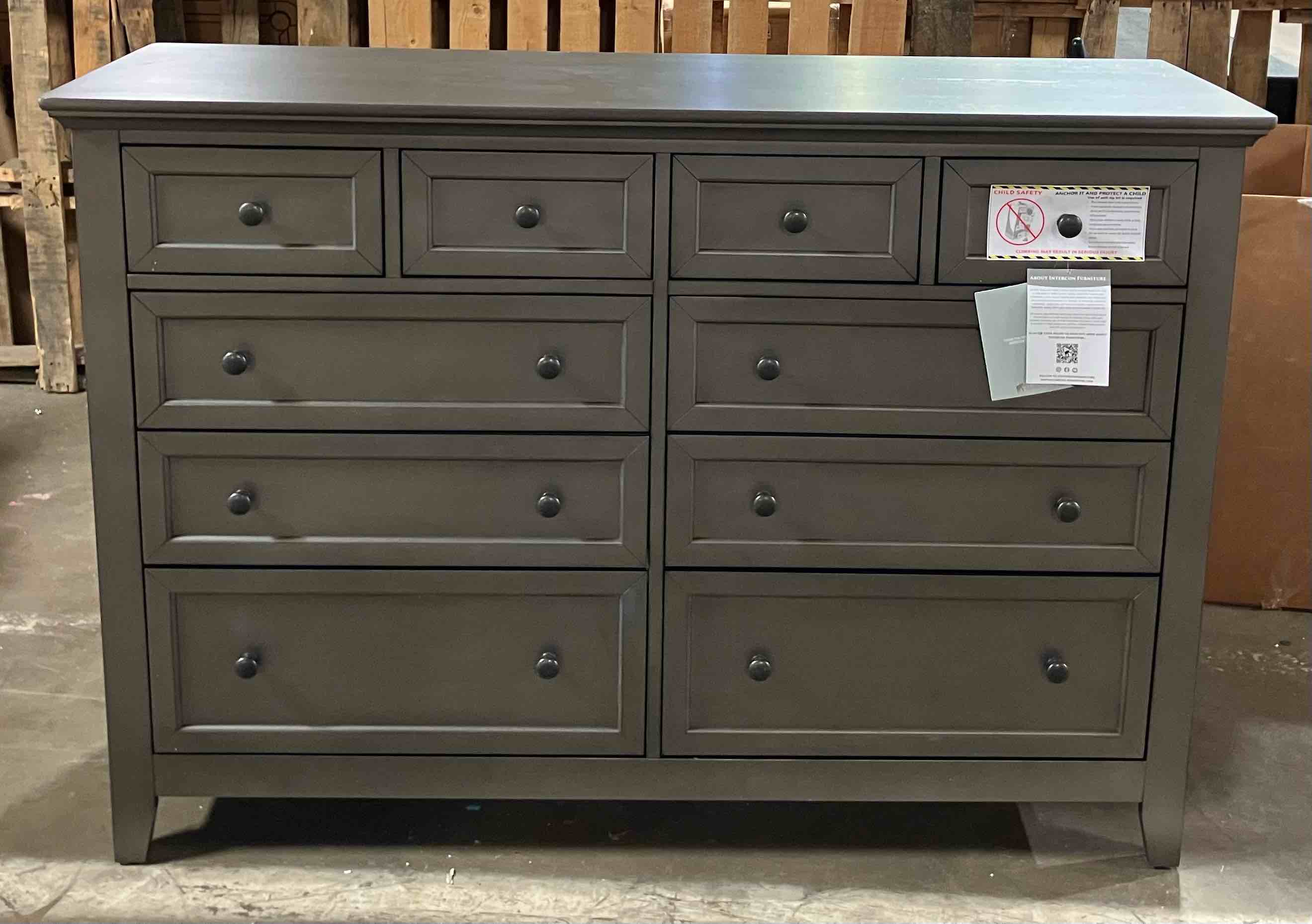 Condition photo showing Good Condition for 60” san mateo grey 10-drawer dresser - (good condition because of a worn front right corner, pictured, and some indentations on the top odd dresser, also pictured)