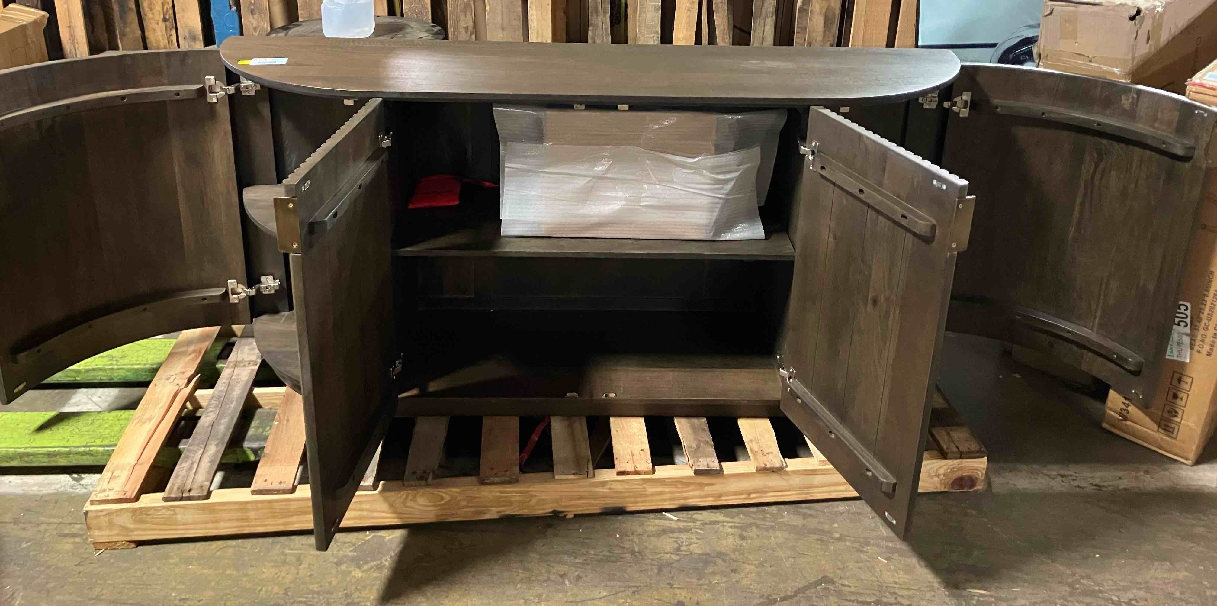 Condition photo showing New/Like New for terra dark brown fluted 4 door sideboard - (item is new/like new, but it is noted that there are some small scratches on the top, pictured, and some scrapes on the back that are not visible from the front)