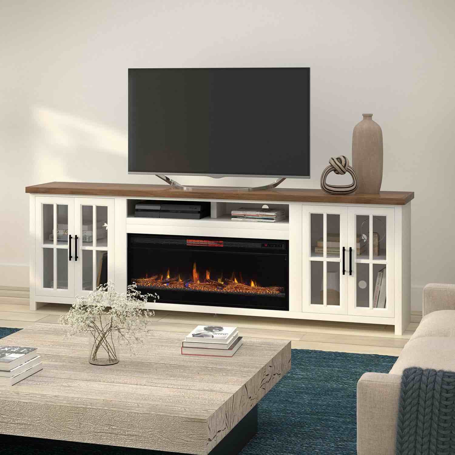 Condition photo showing Good Condition for legends furniture distressed jasmine white alder wood hampton super fireplace console with 2 single shelf cabinets, 2 top shelves, oil rubbed metal handles, and electric fireplace. some damage to outer right side does not effect cabinet or function, back needs reattached on bottom right side, otherwise brand new. height (in) 32 width (in) 97.31 depth (in) 17.38