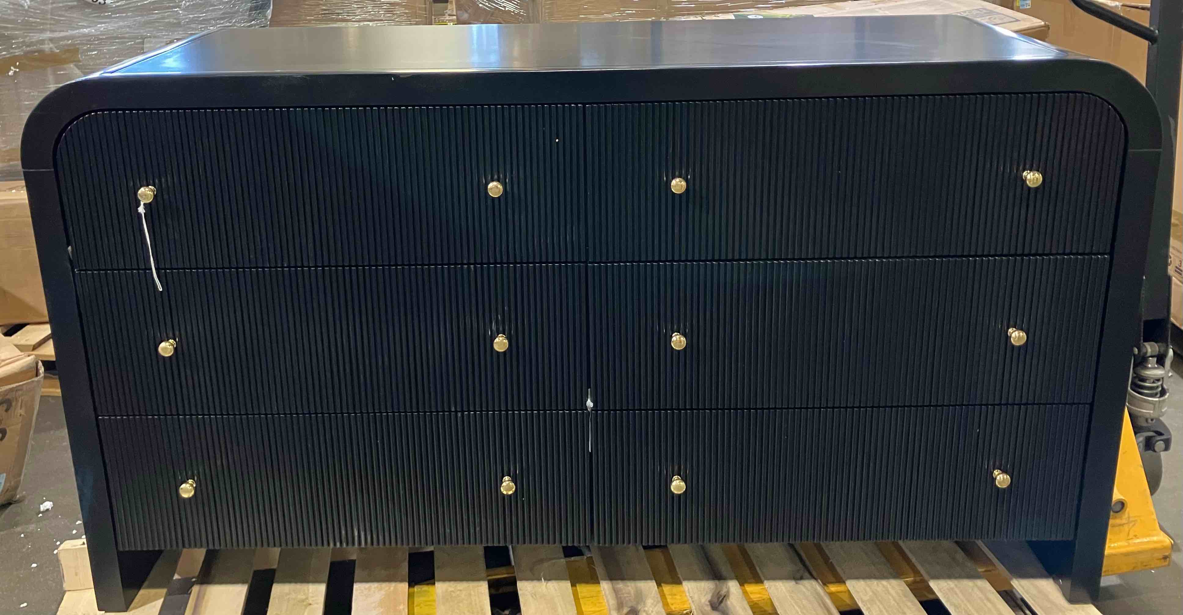 Condition photo showing Good Condition for liabella 6 drawer curved dresser 62" x 20" x 34" - (good condition because of scratches on the sides and top, a crooked drawer knob, and a piece of the rear right leg is broken, pictured, and doesn’t affect the function)
