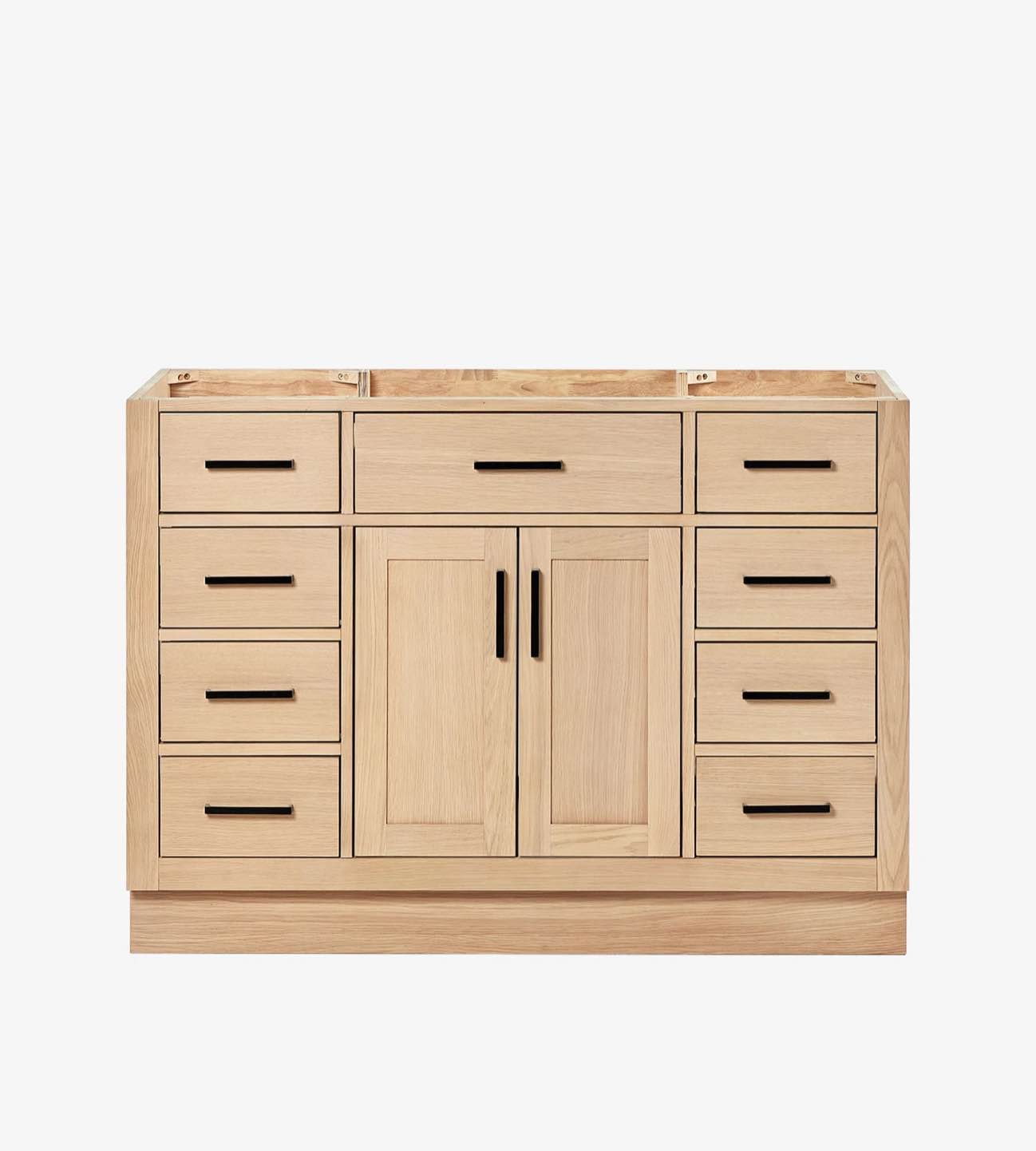 Condition photo showing New/Like New for ariel hepburn 48 inch single sink base cabinet in light oak with 9 drawers, 1 open space cabinet, black metal handles, and carrara white quartz top. 48"w x 21.5"d x 34.5"h