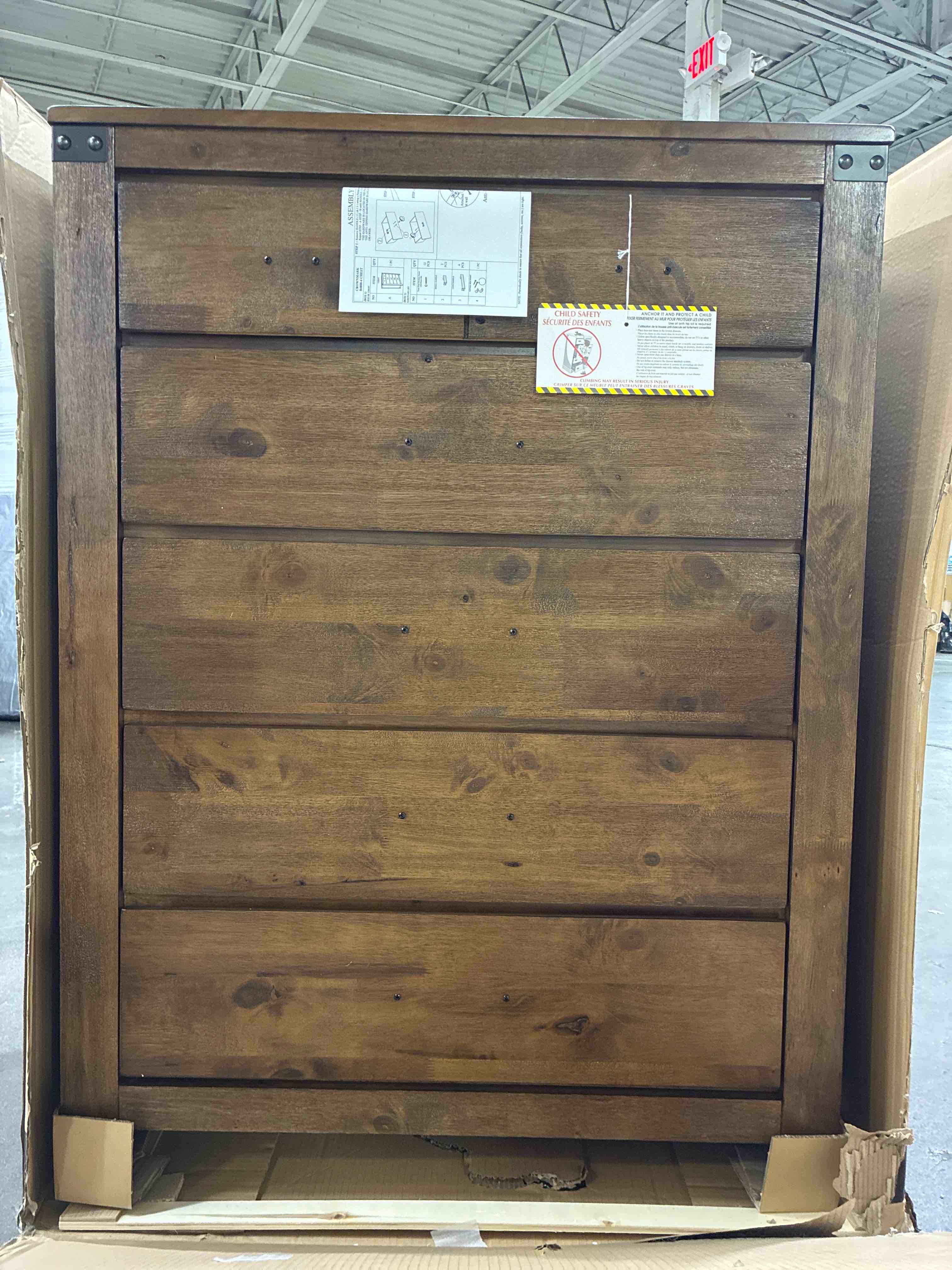 Condition photo showing New/Like New for curtis rustic brown panel 5 drawer dresser chest with iron handles. minor holes along backing, do not effect style or function of dresser, is considered like new. 37 x 17.7 x 49.7 h