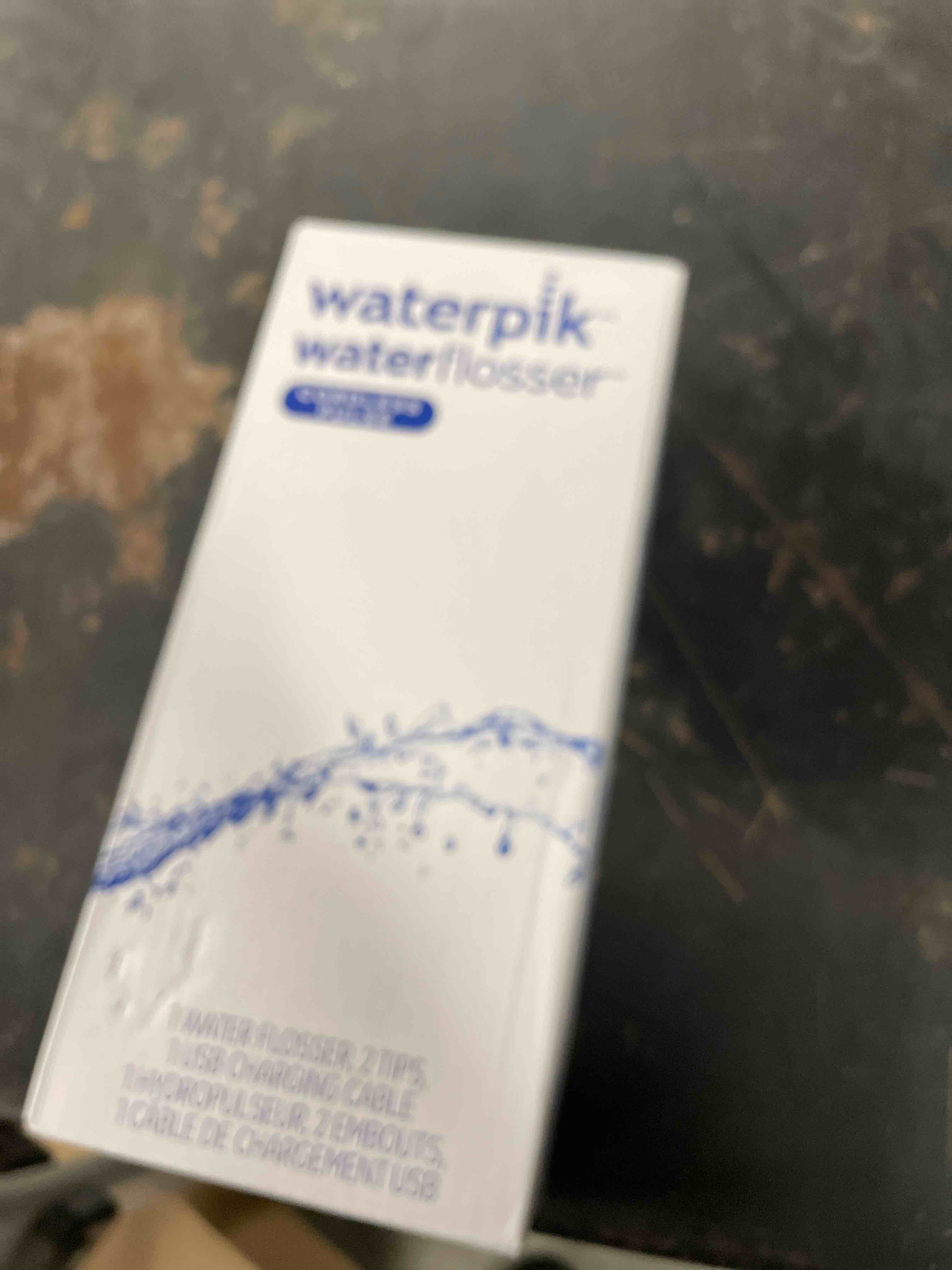 Condition photo showing New/Like New for Waterpik Cordless Pulse Rechargeable Portable Water Flosser for Teeth, Gums, Braces Care and Travel with 2 Flossing Tips, Waterproof, ADA Accepted, WF-20 Blue, Packaging May Vary