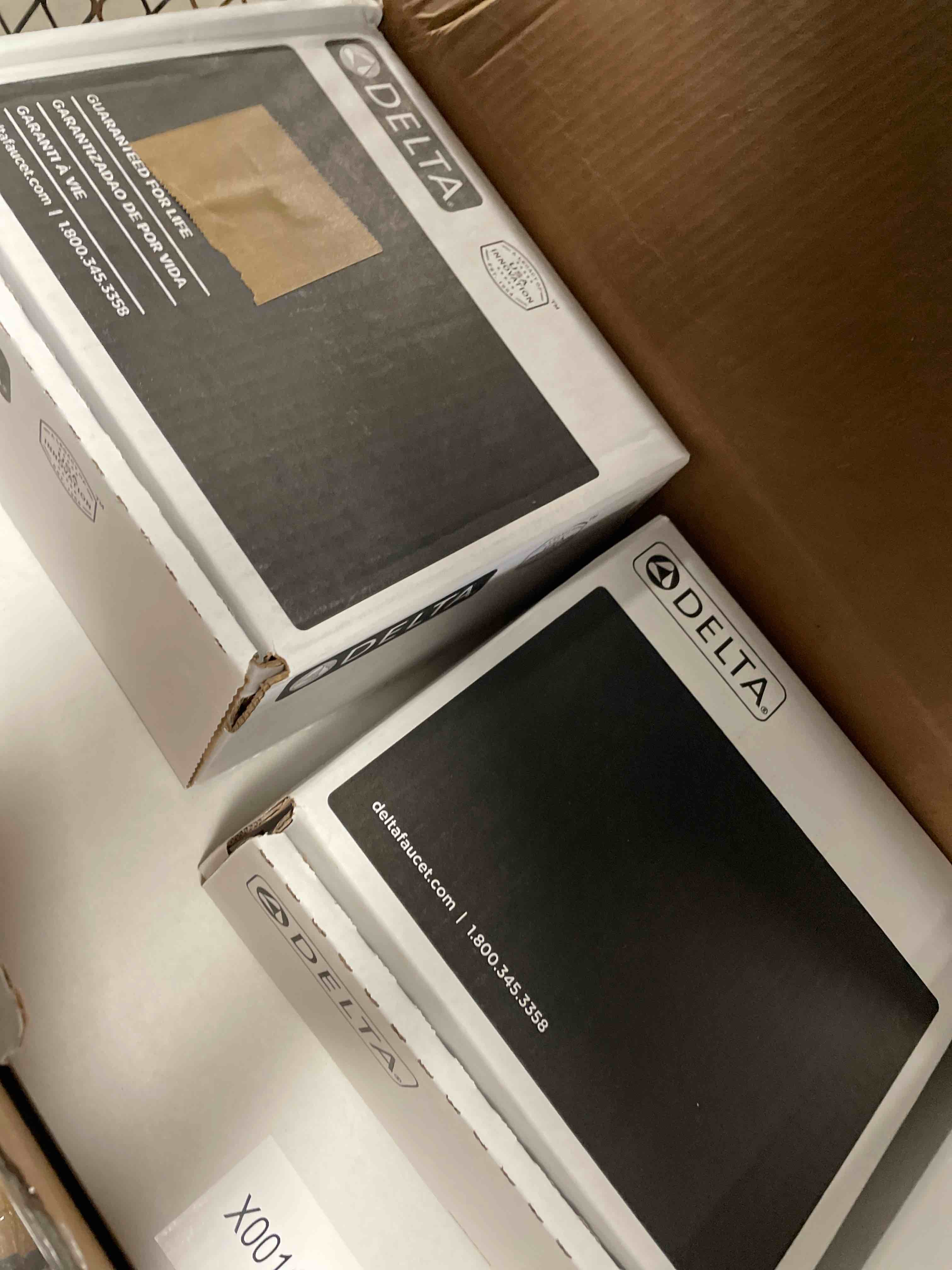 Condition photo showing New/Like New for Delta Faucet Modern Raincan 2-Setting Round Shower System Including Rain Shower Head and Handheld Spray Gold, Rainfall Shower System Gold, Shower Valve and Trim Kit, Champagne Bronze 342702-CZ