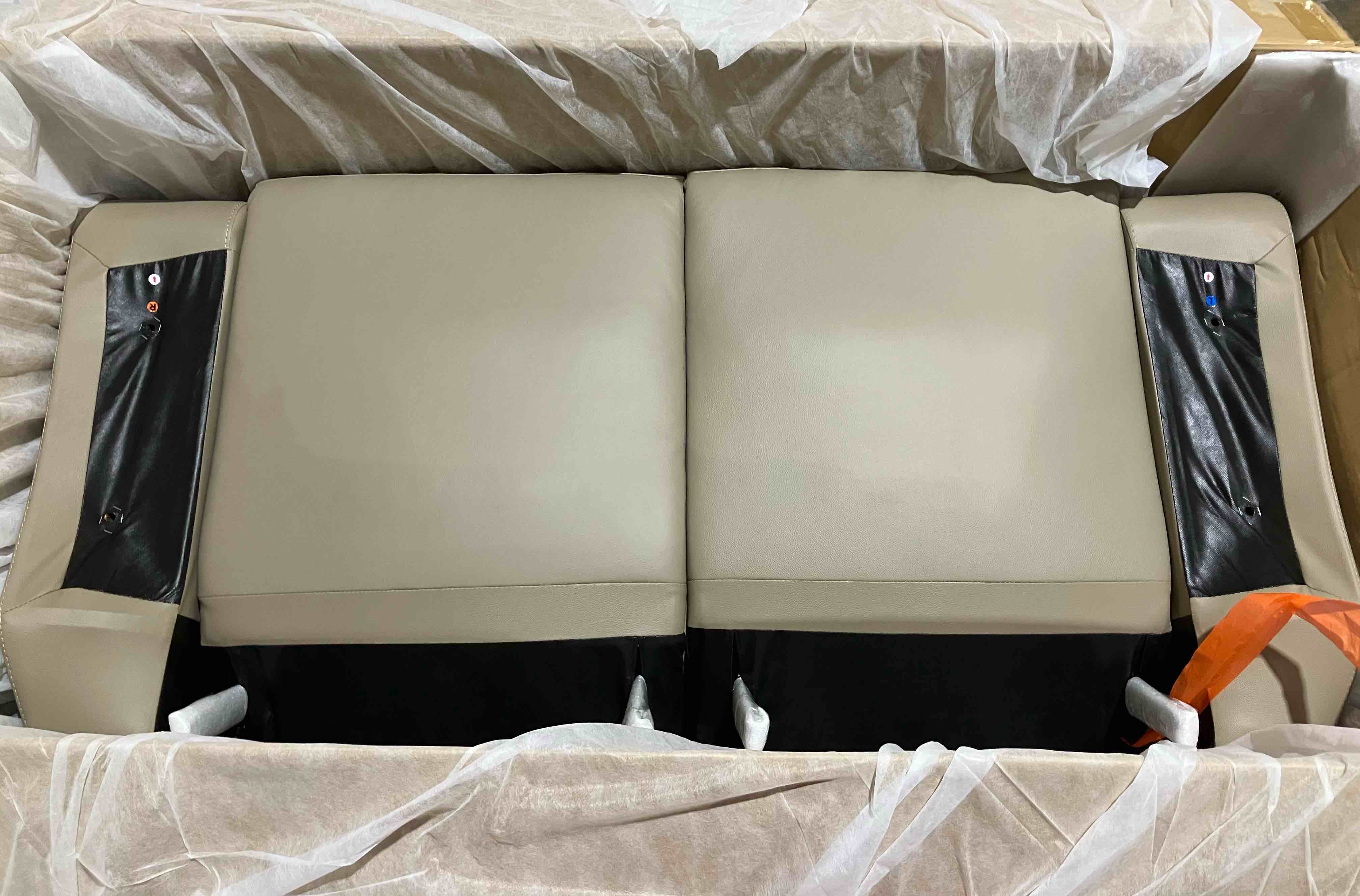 Condition photo showing New/Like New for Sitz 62.5'' Transitional Double Reclining Love Seat - with Top Grain Leather Seating Surfaces and Dual Manual Tab Pull Reclining - Latte