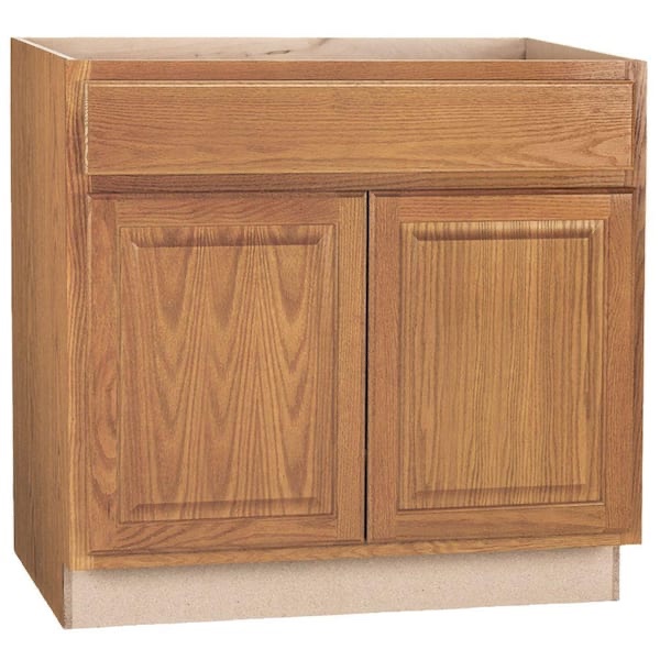 Hampton Bay Hampton 36 in. W x 24 in. D x 34.5 in. H Assembled Base Cabinet in Medium Oak - (As is because wood on left side of cabinet is busted in the front and back, pictured)
