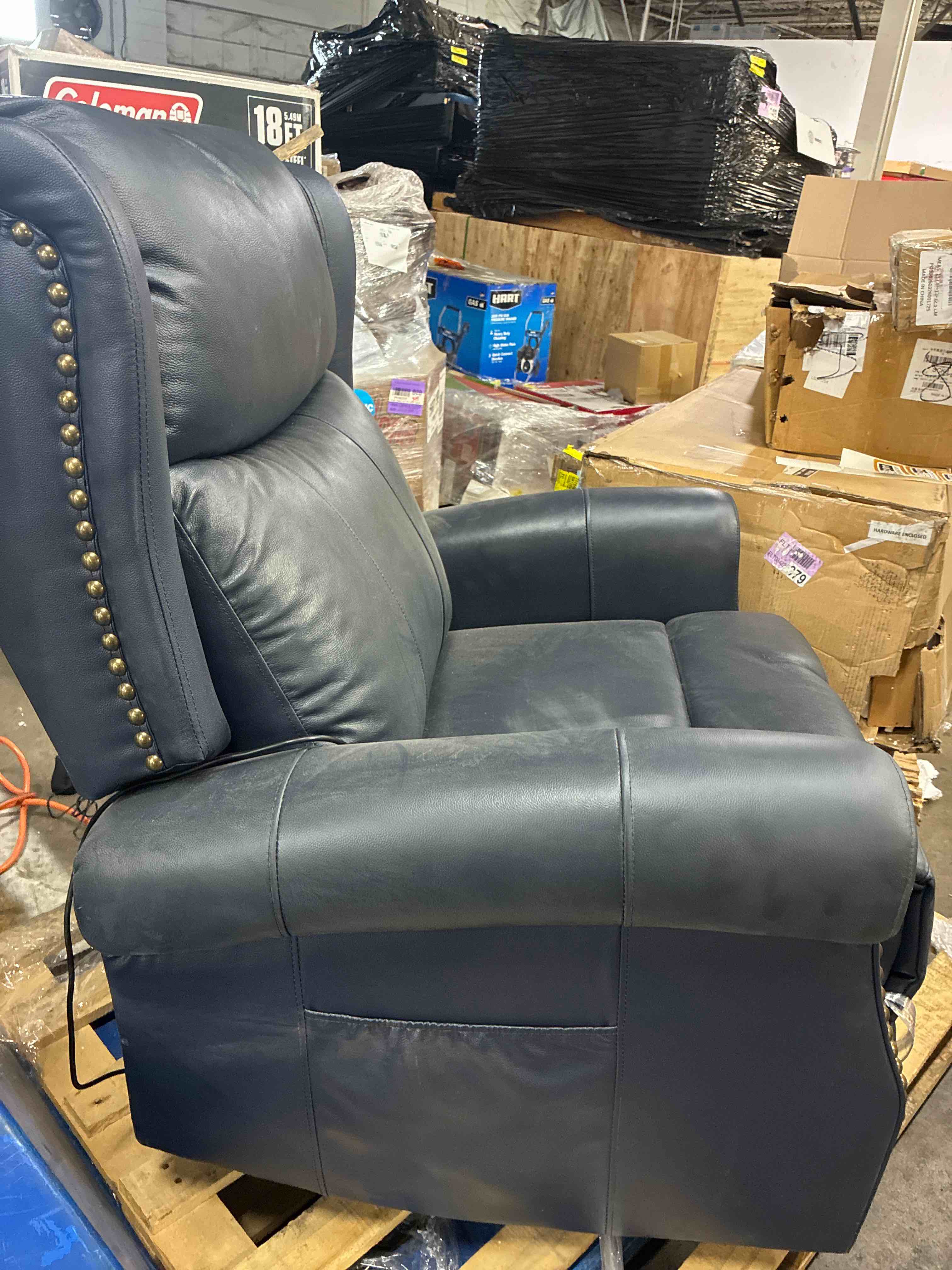Condition photo showing Good Condition for 34.8"W Gold Button Upholstered Blue Genuine Leather Manual Swivel Rocker Recliner With Heated Massage Capability. Minor marks along chair, functions perfectly. 40.9'' H X 34.8'' W X 39.2'' D