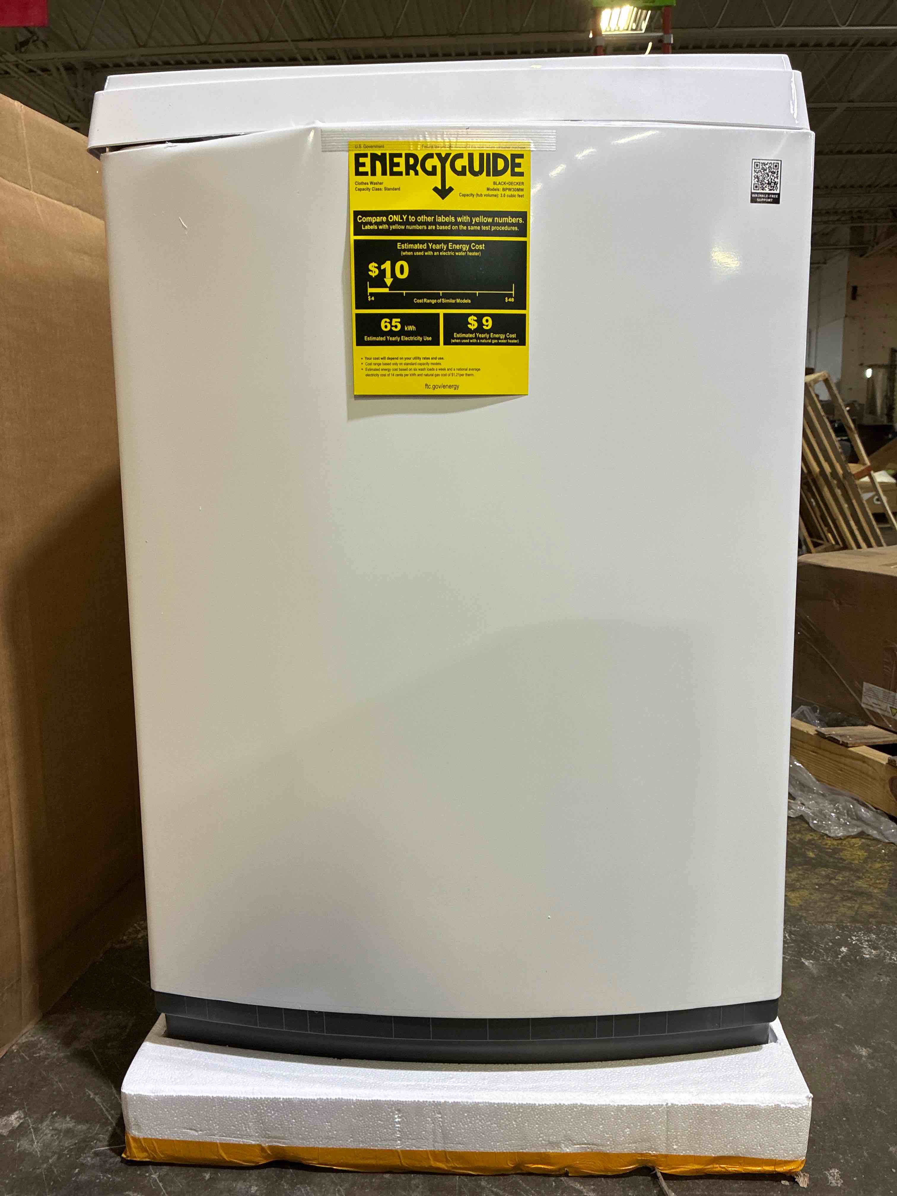 Condition photo showing As Is for BLACK+DECKER 3.0 Cu. Ft. Portable Washer, 26.5 lb. Capacity Washing Machine, 6 Cycles, Quick Connect Sink Adapter and Drain Hose Included, Transparent Lid & LED Display, BPW30MW, White. Dented on front and side interior in brand new condition, front and left need professional repair. 