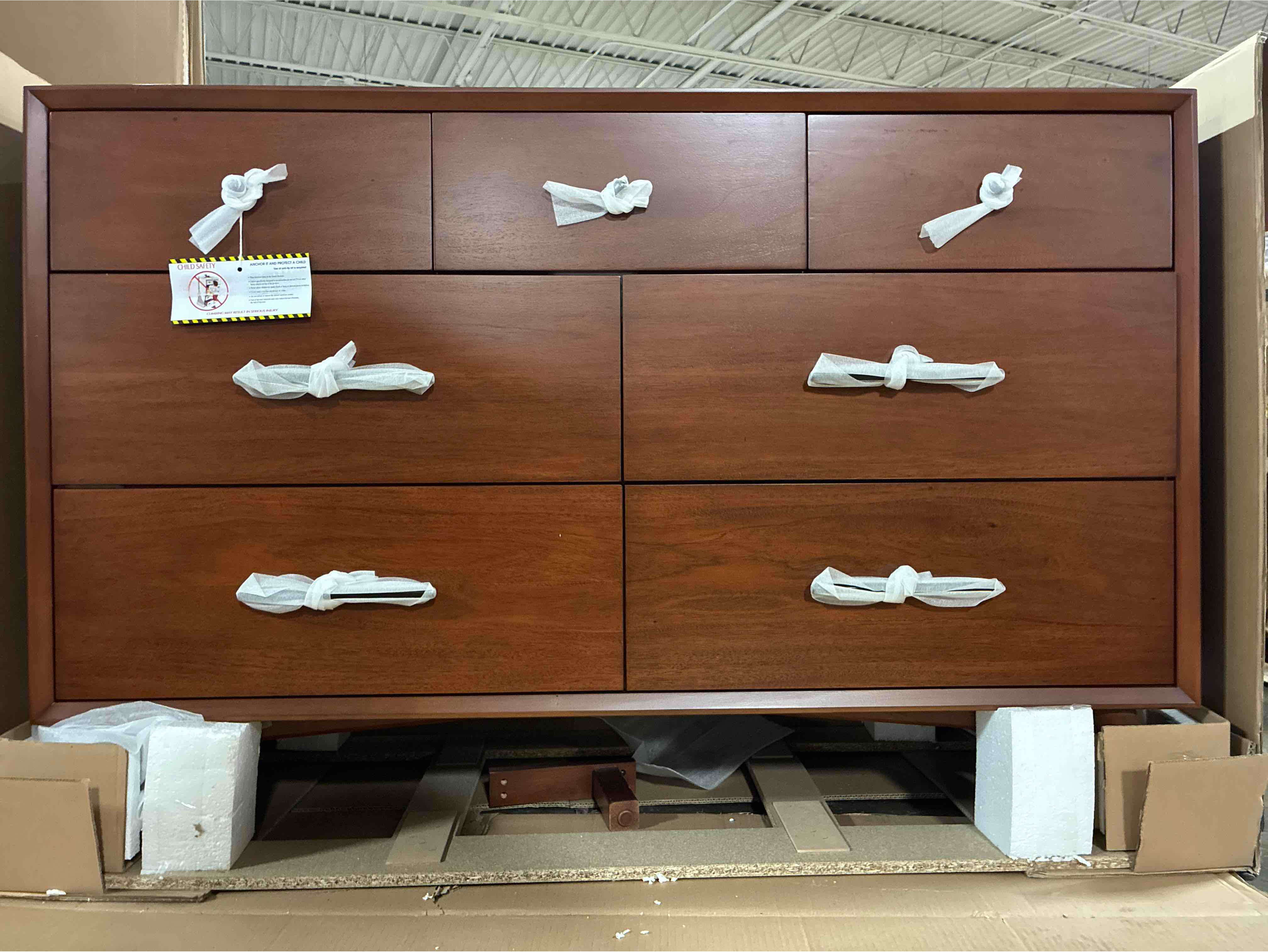 Condition photo showing New/Like New for Williams 7-Drawer Chestnut Dresser with Matte Black Handles and Knobs, 36.5'' H X 56'' W X 19'' D