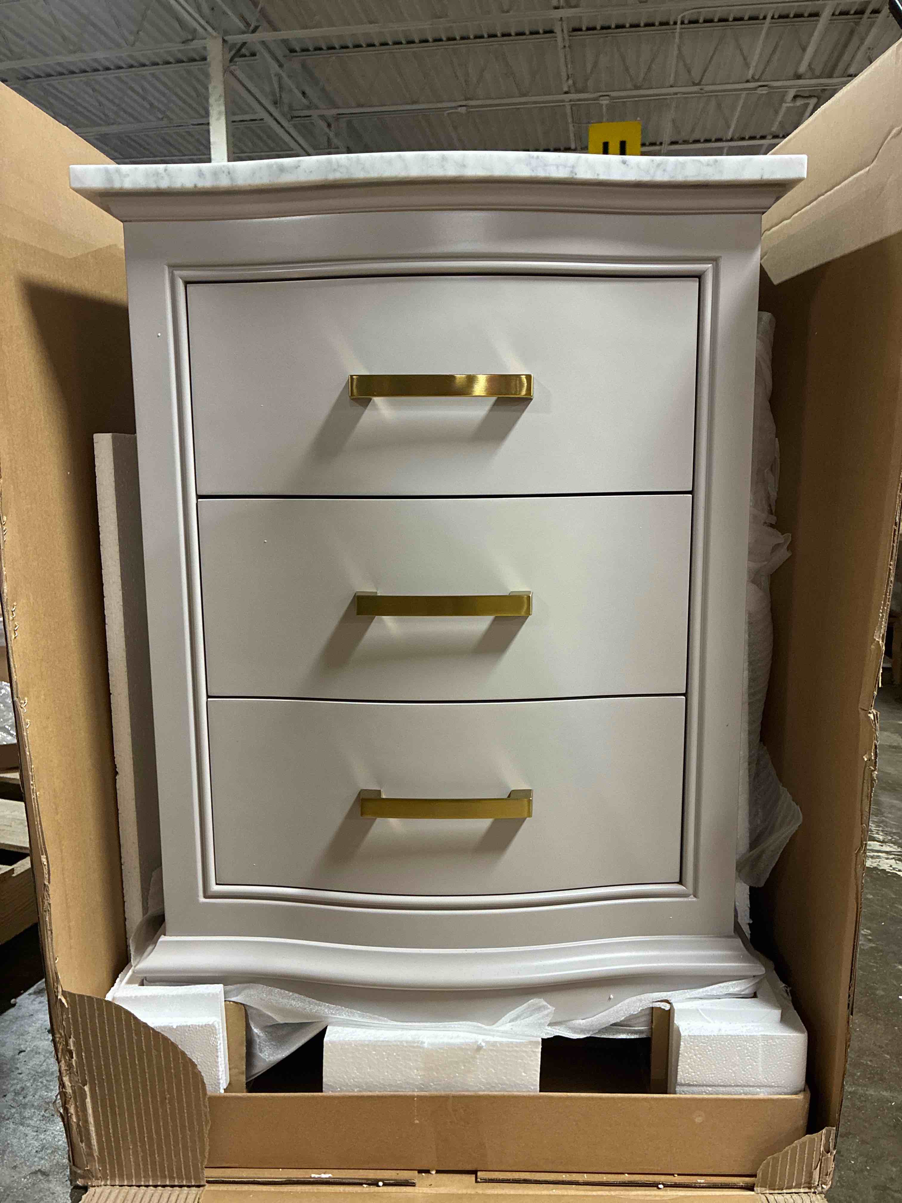 Condition photo showing New/Like New for Goleta 24'' Taupe 3 Drawer Single Bathroom Sink Vanity with White Carrara Marble Top and Gold Brushed Handles. 34'' H X 24'' W X 22'' D
