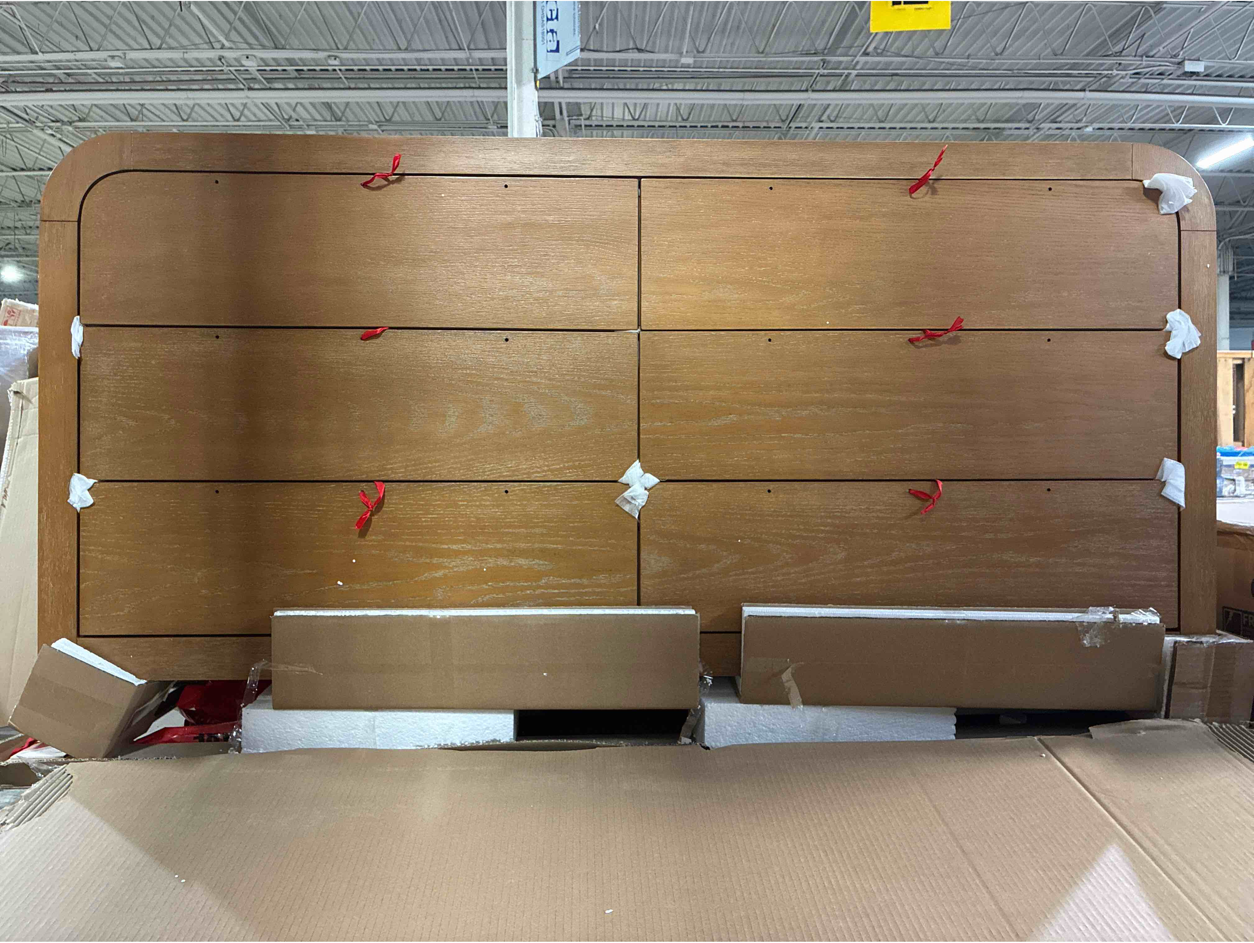 Condition photo showing Good Condition for Grith 64" Wide Natural Hickory Mid-Century 6-Drawer Dresser with Wooden and Silver Tipped Handles. Chip on left side of dresser otherwise brand new. 35.98'' H X 64.02'' W X 17.99'' D