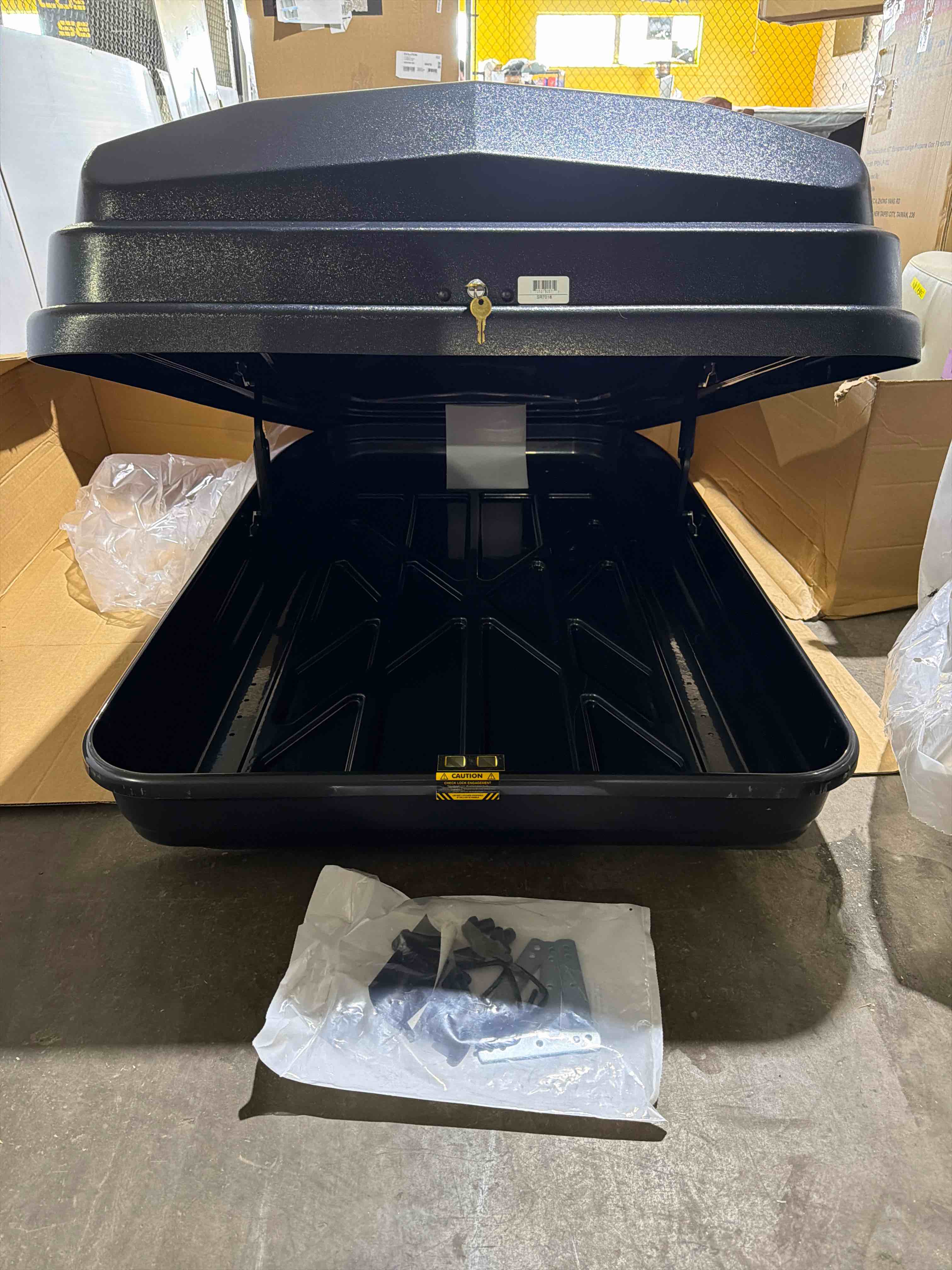 Condition photo showing New/Like New for black vista xl car cargo box, 18 cubic feet of storage, rear opening for easy loading, tool free mounting hardware, dimensions: 63? x 38? x 19”, 