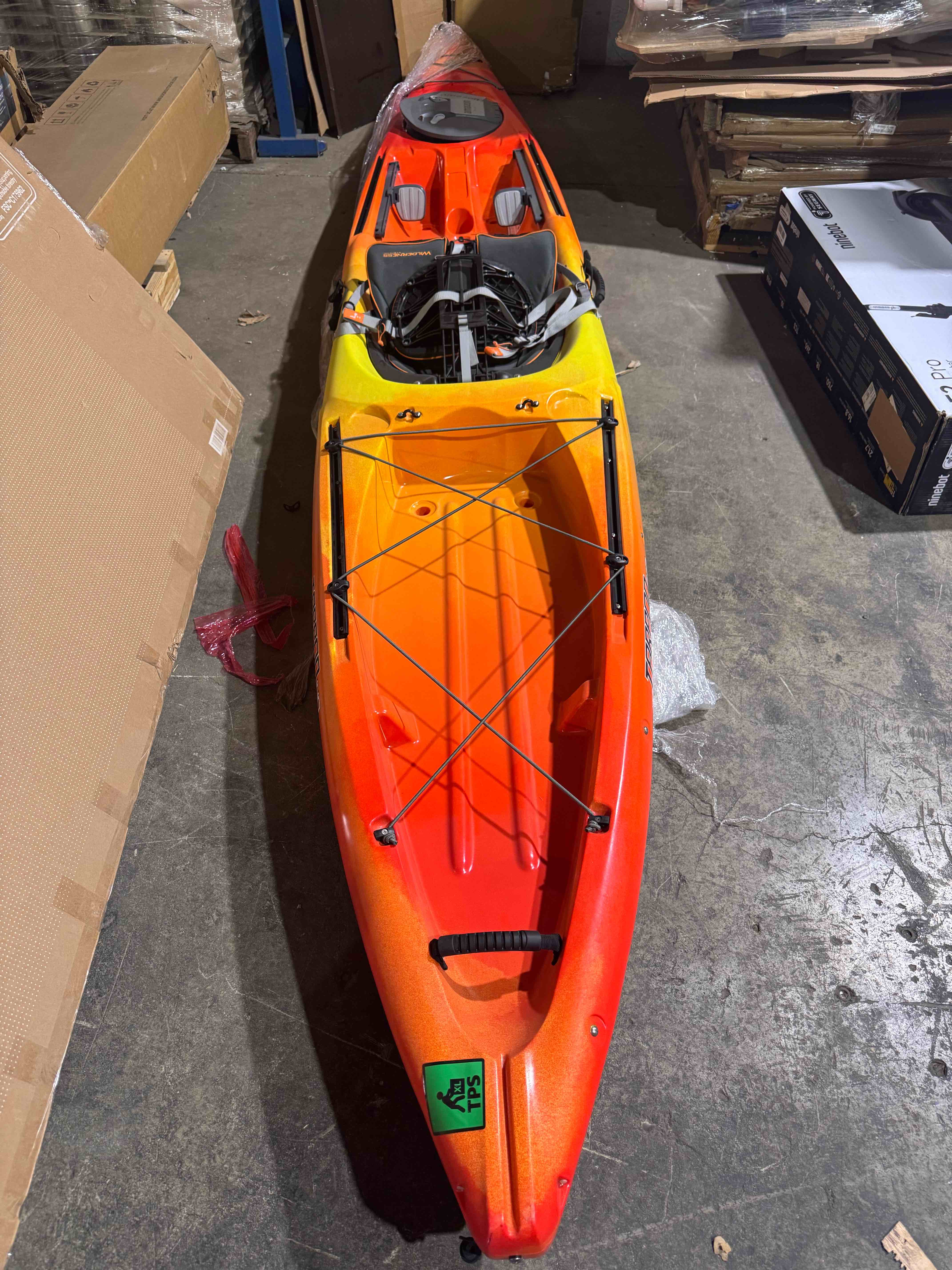 Condition photo showing Good Condition for wilderness systems tarpon 140 recreational kayak- kayak has hole on port side (can be patched) and small scuffing on bottom (pictured) 25.5” x14” x 168”