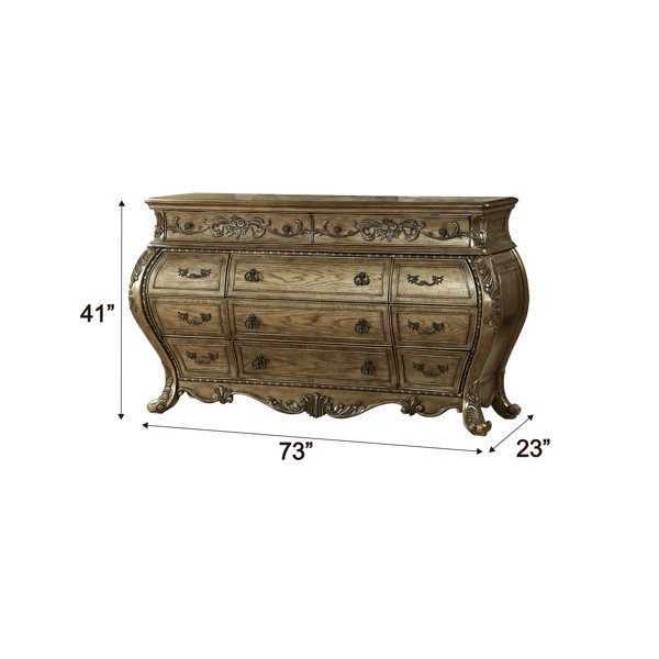Condition photo showing As Is for gold anastazia 11-drawer dresser- dresser has small chip in top, front right leg cracked (can filled with wood putty) 41'' h x 73'' w x 23'' d