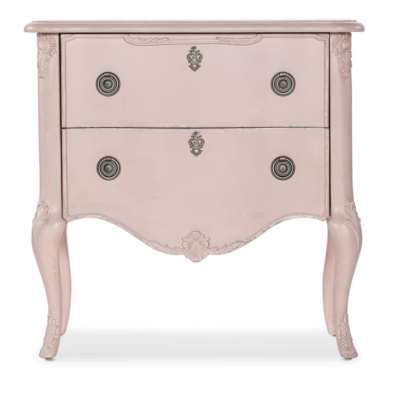 Hooker Furniture Flourish Accent Chest in Pink Wood Finish with Decoratively Carved Satin Nickel Handles and Accents. Back left leg chipped, some minor paint scuffs along front and top otherwise great quality nightstand, 29.75'' H X 30'' W X 16'' D
