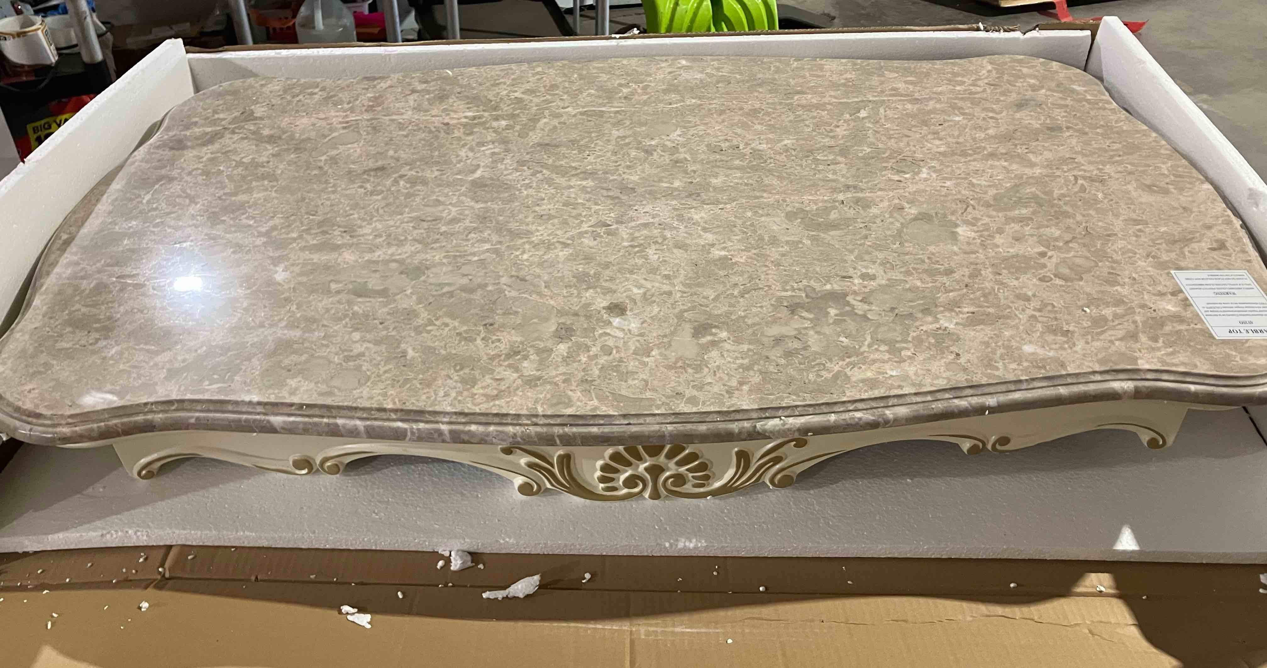 Condition photo showing As Is for Chantelle Pearl White Marble Top Coffee Table - (As is because of small crack on underside, and a broken leg, both pictured)