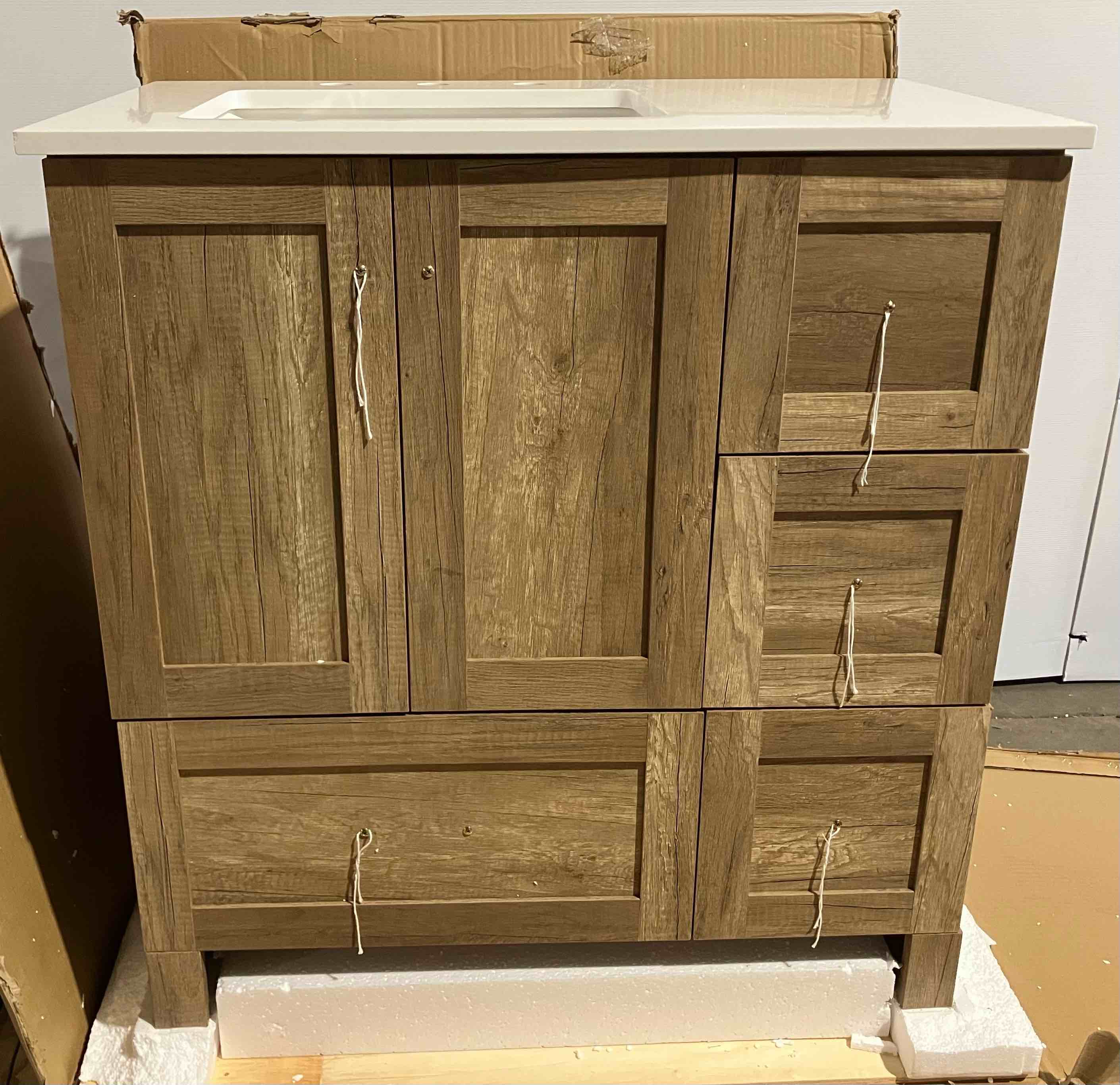 Condition photo showing Good Condition for Soma 32'' Single Bathroom Vanity with Engineered Marble Top - (Good condition because of small chip in front left corner of vanity top, pictured)