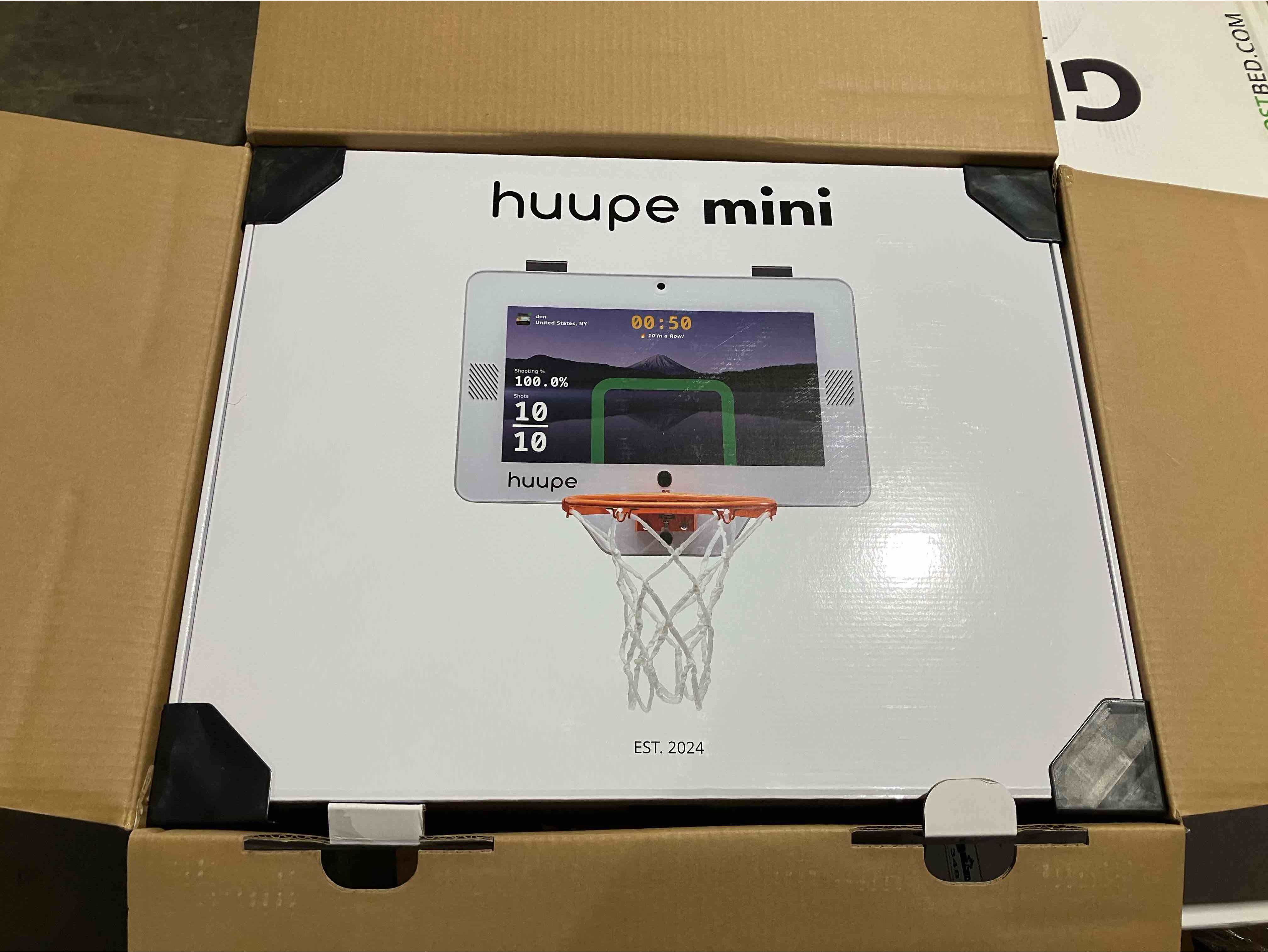 Condition photo showing New/Like New for Huupe Mini Pro Pack Smart Hoop -  Includes: wall mount kit, 2 balls, $25 H-Bucks, charging cord, and more