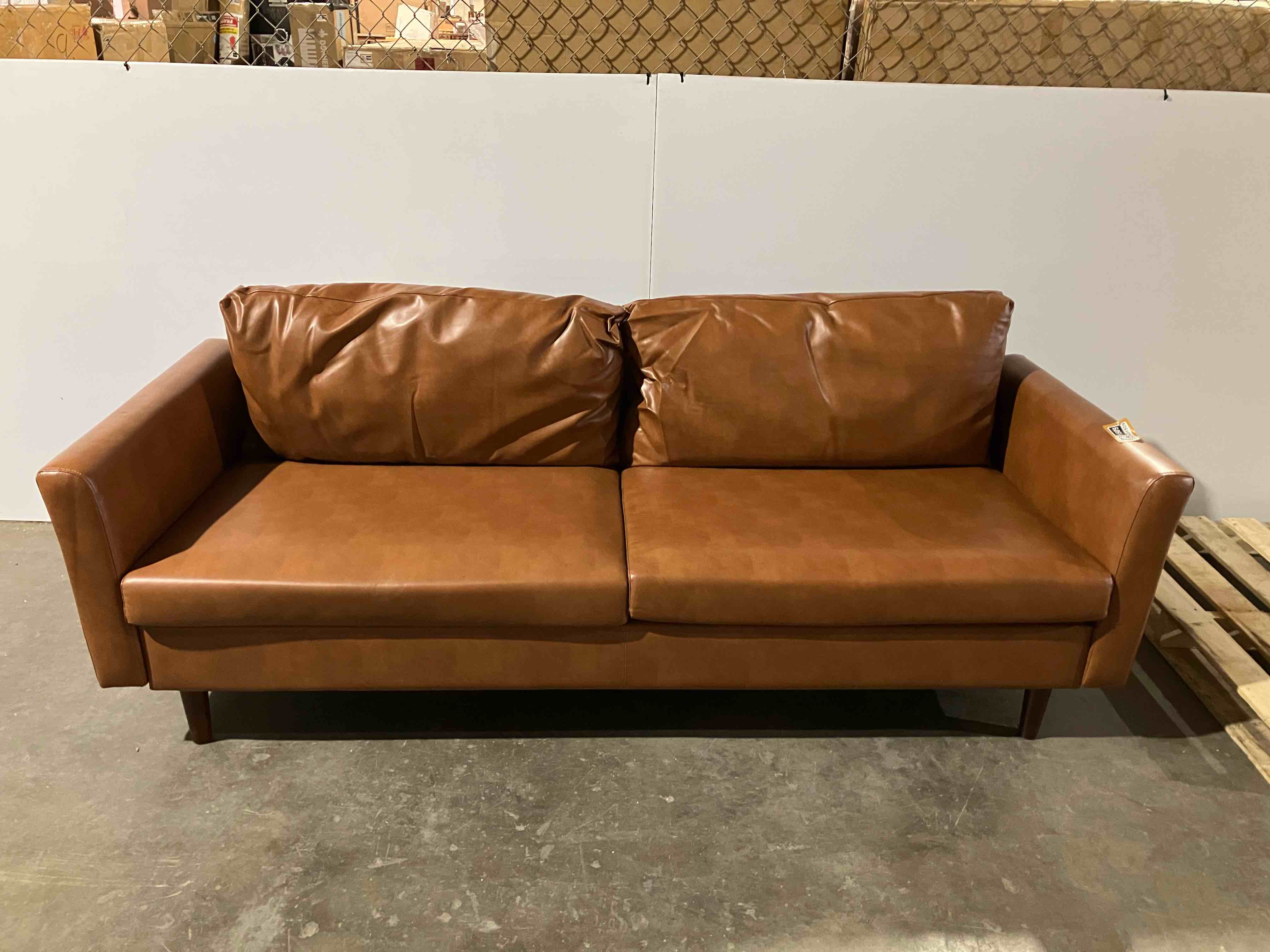 Condition photo showing Good Condition for Wade Logan® Bobur 81" Vegan Leather Flared Arm Removable Cushion Sofa in Caramel Brown - (minor 5mm tear on left arm)