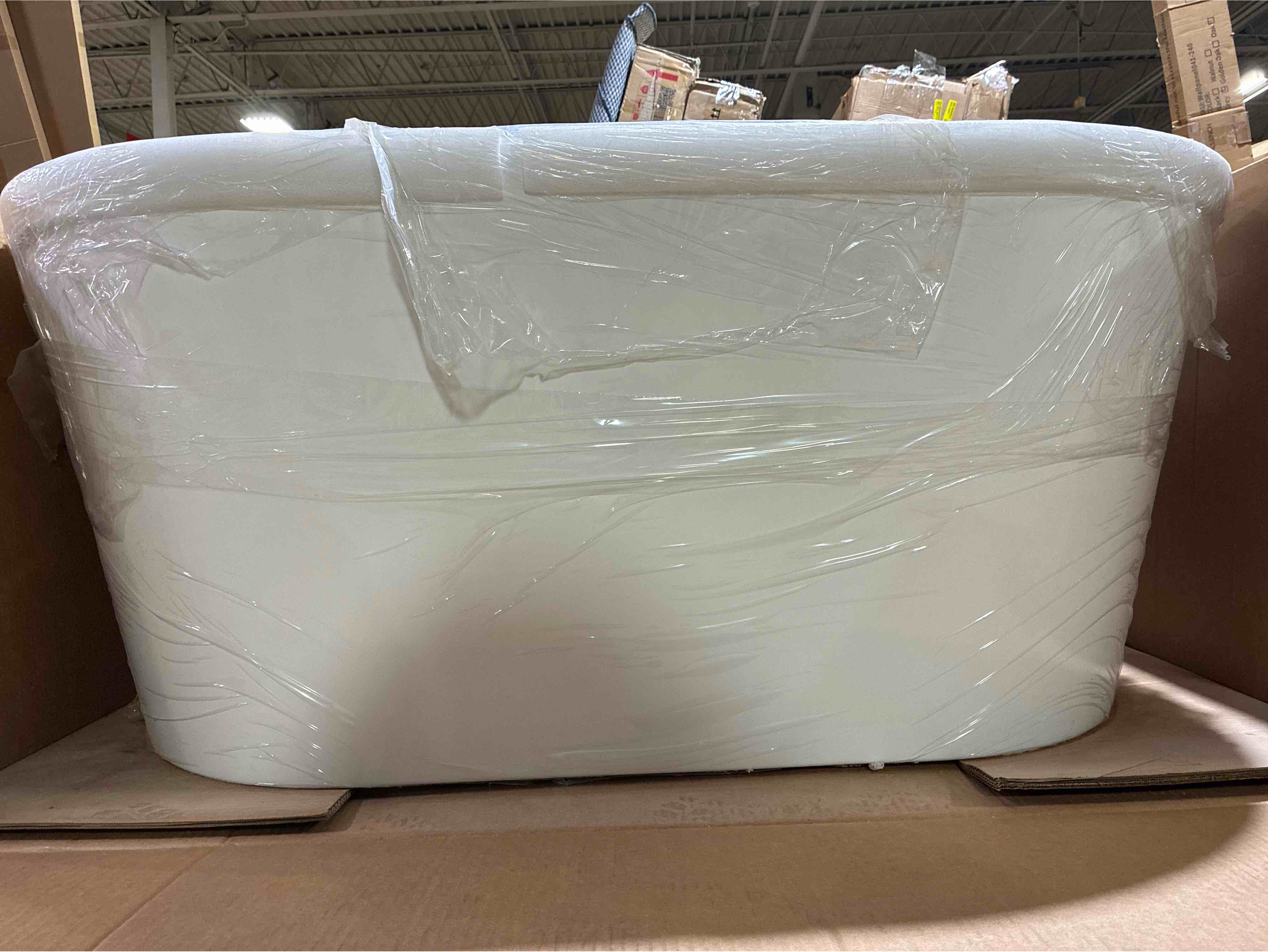 Condition photo showing Good Condition for Iris 54" x 30" Freestanding Soaking Acrylic Bathtub, Hardware sold separately, thin cosmetic grade crack along inner edge, can be recoated, otherwise brand new. 