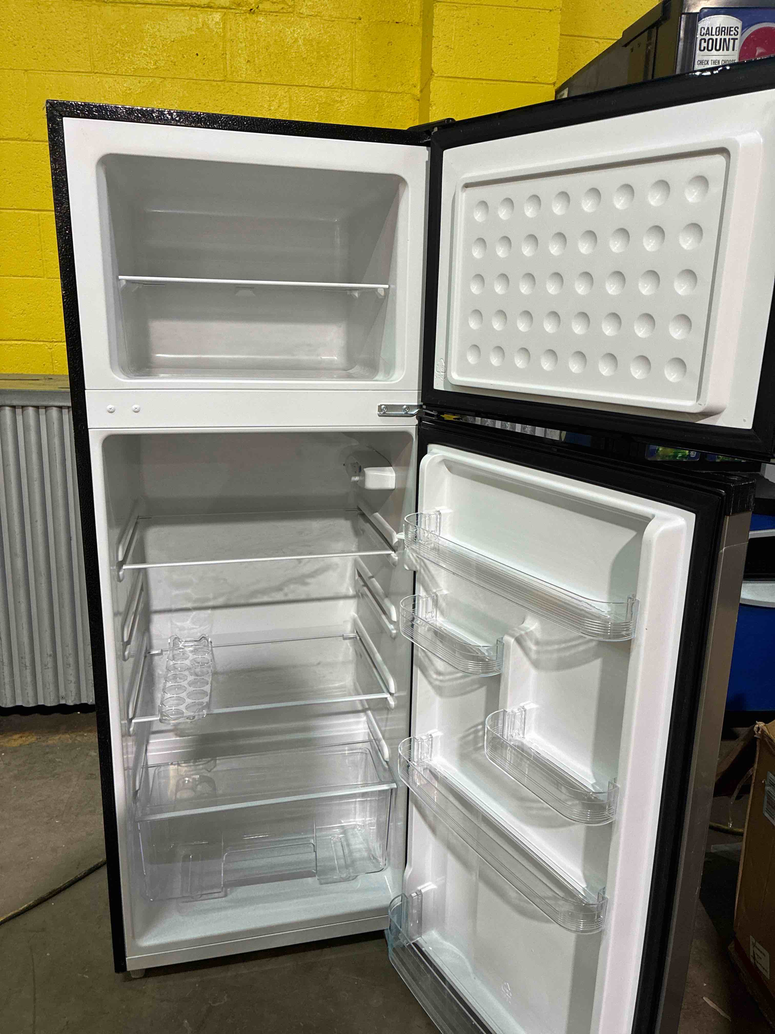Condition photo showing Good Condition for  Frigidaire 7.5-cu ft Counter-Depth 21.5-in Wide Top-Freezer Refrigerator. Gently used, gets cold rapidly.