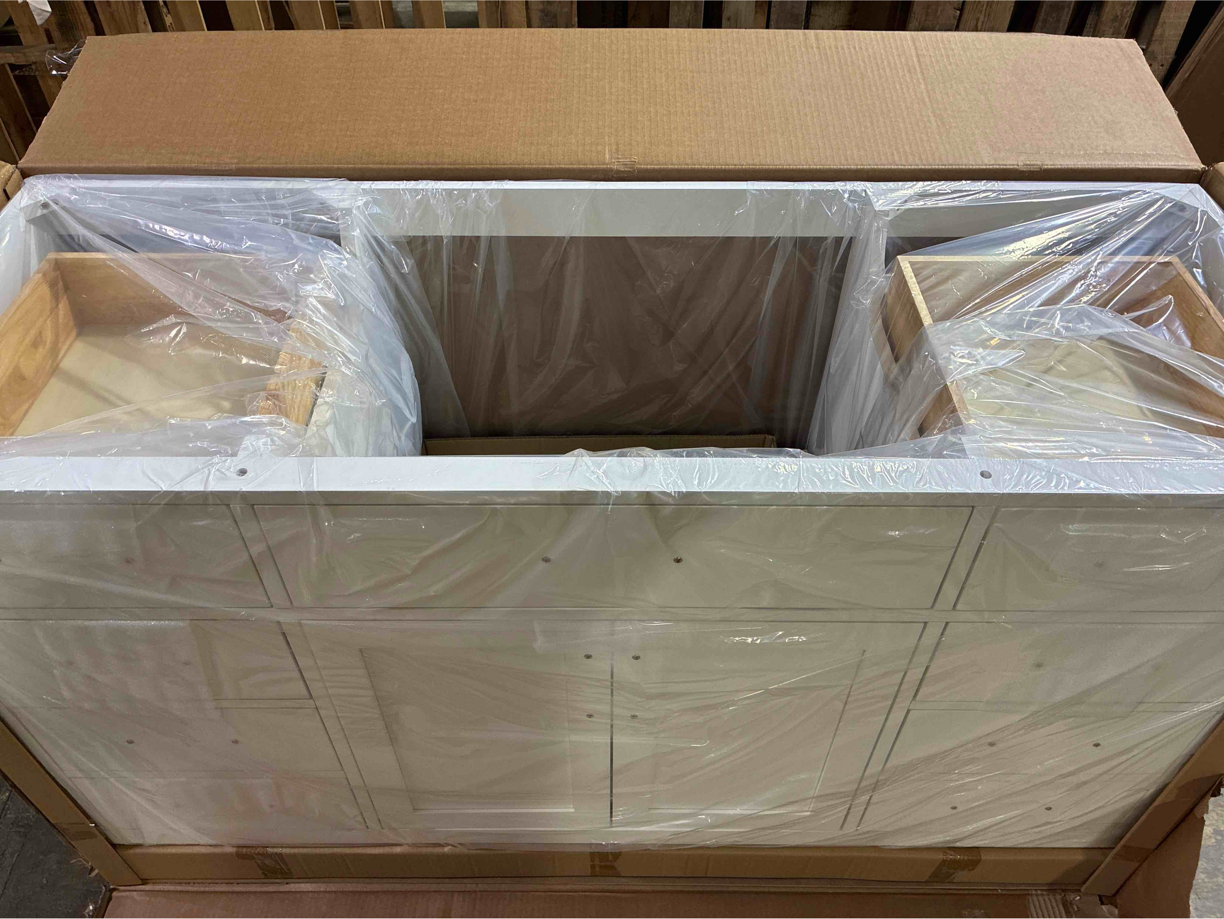 Condition photo showing New/Like New for Ariel Hepburn 60 In. White Rubberwood Single Sink Bathroom Vanity Base, with 9 Drawers, 1 Open Space Cabinet, Black Handles. Sink bowl included in brand new condition, sink top sold separately can be purchased through Ariel in a variety of styles. 60"W x 21.5"D x 34.5"H 