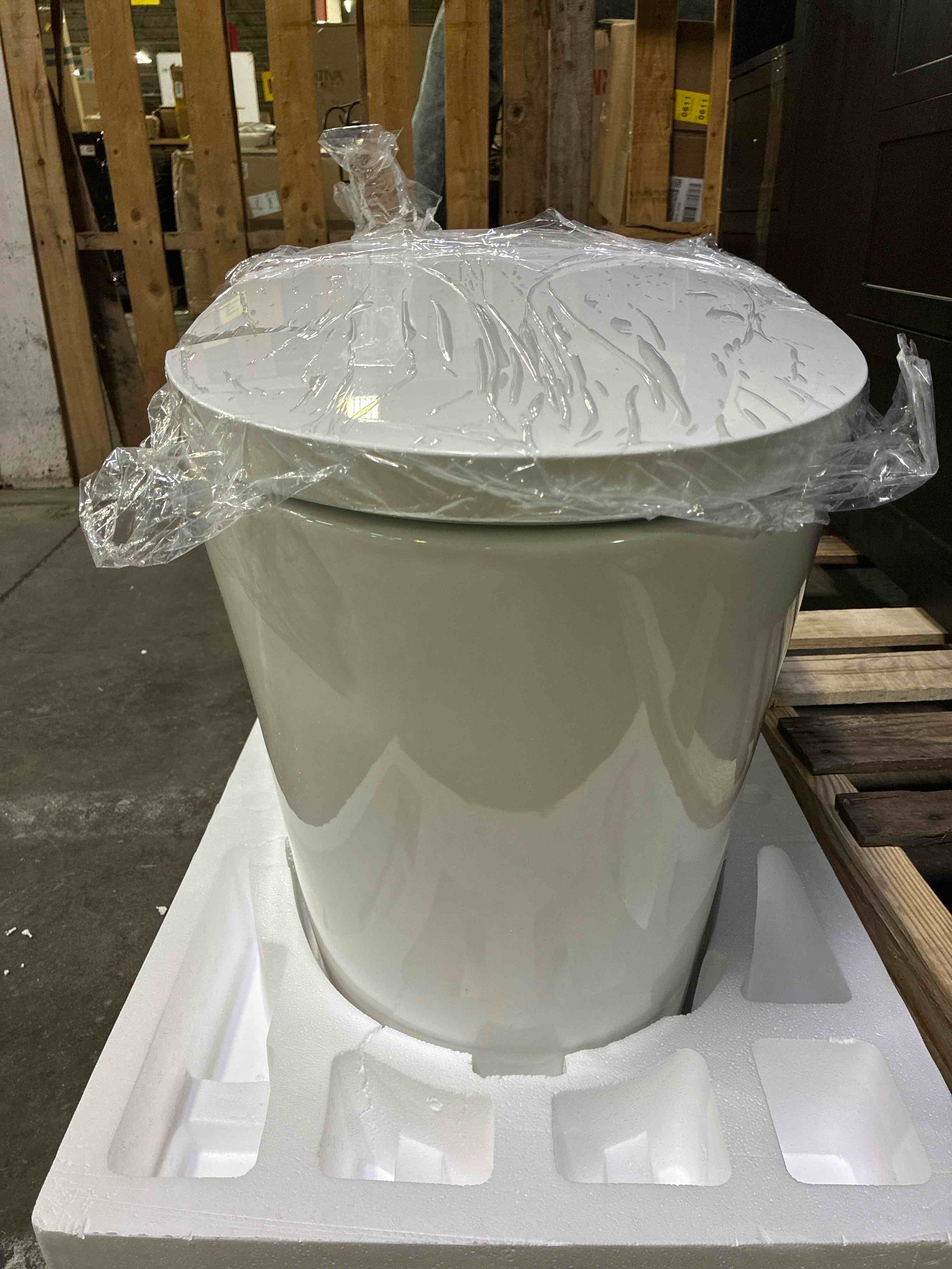 Condition photo showing Good Condition for WOODBRIDGE B0970S Smart Bidet Toilet Elongated One Piece Modern Design, Foot Sensor Operation, Heated Seat with Integrated Multi Function Remote Control in White. Lid has crack on side, can be replaced through wayfair. 
