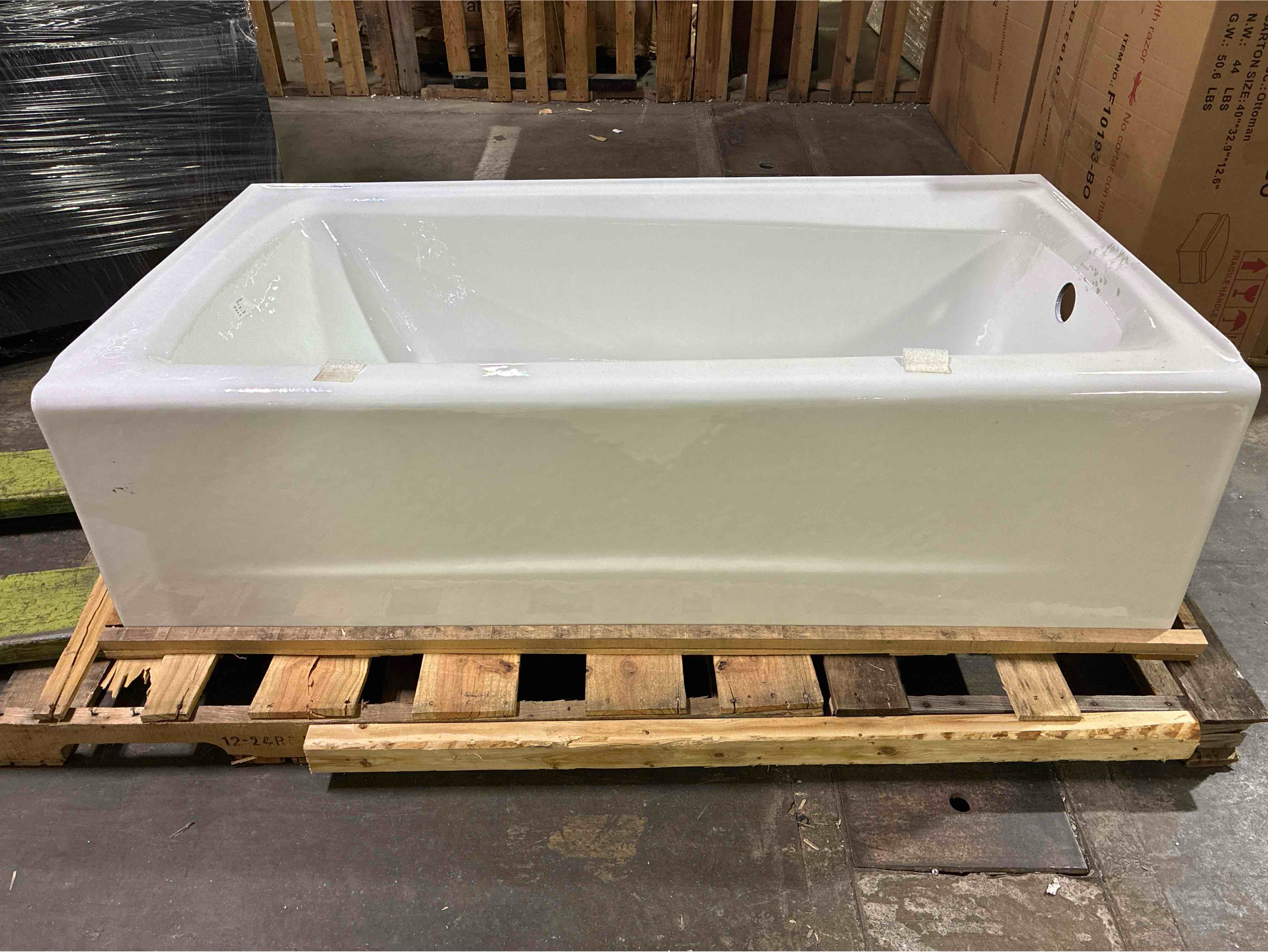 Condition photo showing Good Condition for Irvine 60" x 32" Alcove Bath with Right-Hand Drain, Cast Iron Interior White High Gloss Exterior. Hardware sold separately some scuffing along right edge otherwise brand new. 