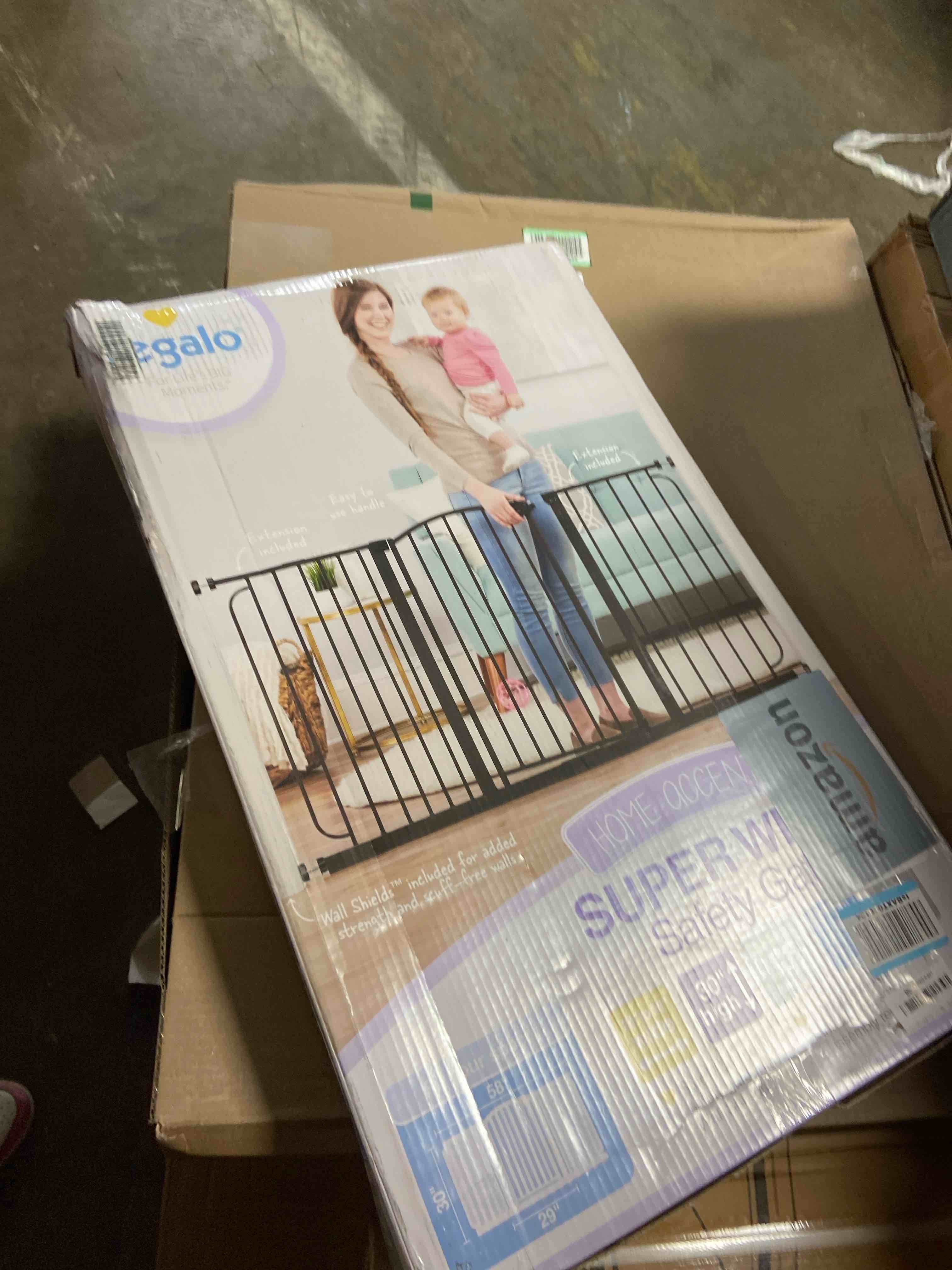 Condition photo showing New/Like New for Regalo 58-Inch Easy Step Extra Tall Arched Décor Walk Thru Baby Gate, Award Winning Brand, Includes 4-Inch Extension Kit, 4 Pack Pressure Mount Kit and 4 Pack Wall Mount Kit, Bronze Black - 29-58"w X 30"h