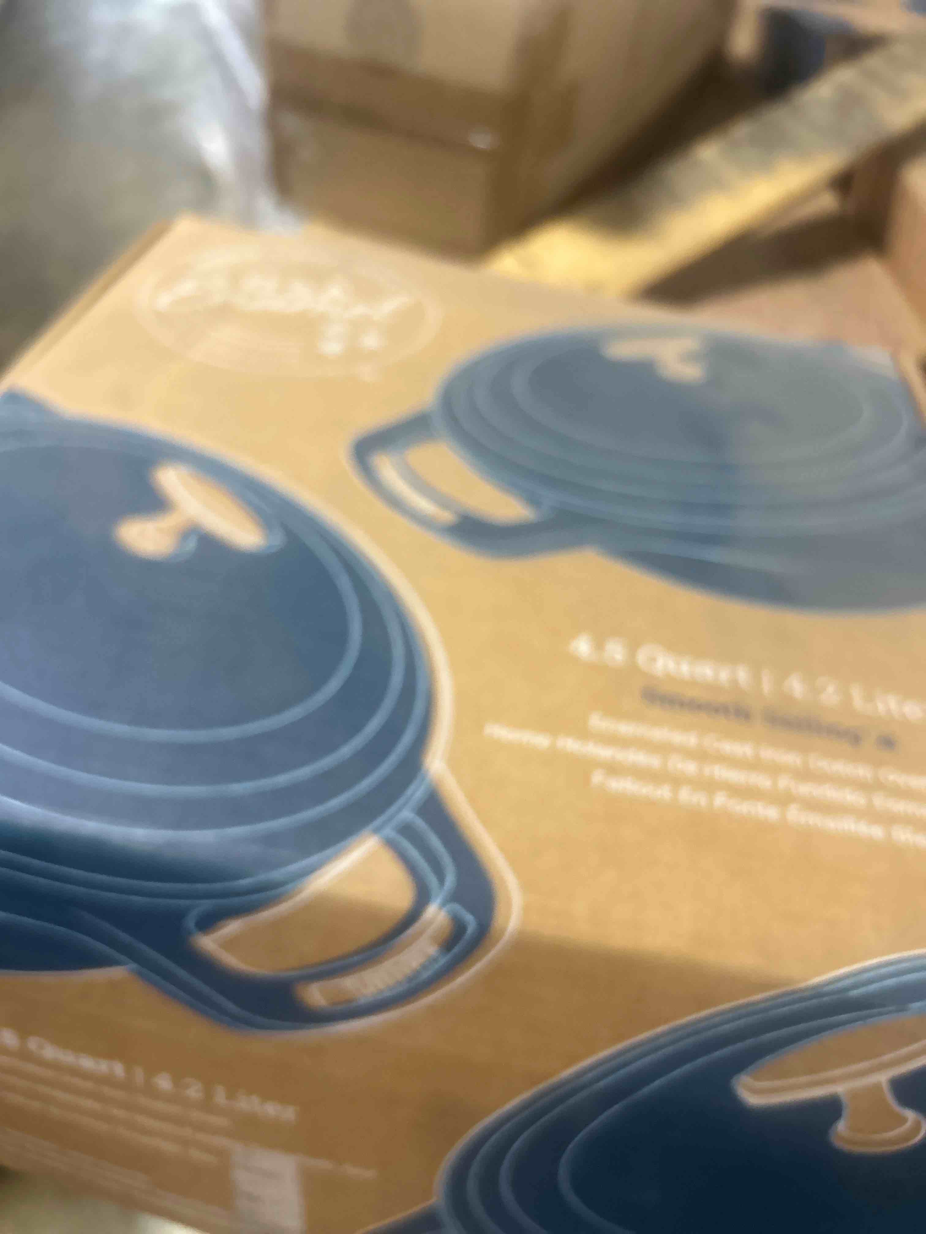 Condition photo showing New/Like New for Lodge 4.5 Quart Enameled Cast Iron Dutch Oven with Lid – Dual Handles – Oven Safe up to 500° F or on Stovetop - Use to Marinate, Cook, Bake, Refrigerate and Serve – Caribbean Blue