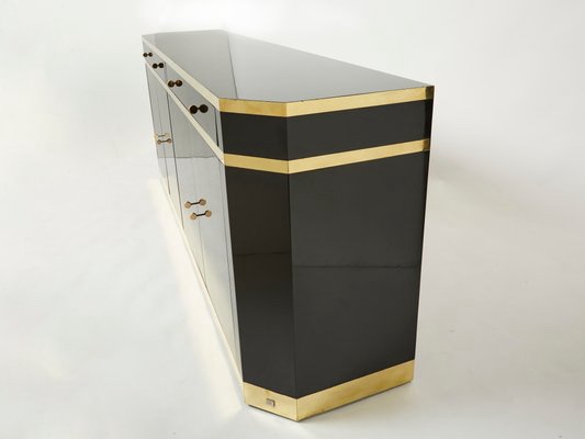 Condition photo showing New/Like New for 4 door 4 drawer black lacquered sideboard with square knobs, gold metal trim, and legs. trim is strip black not solid gold. 