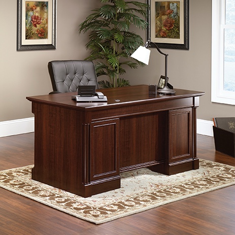 Condition photo showing New/Like New for double ped executive desk in select cherry with 7 drawers and chrome knobs 