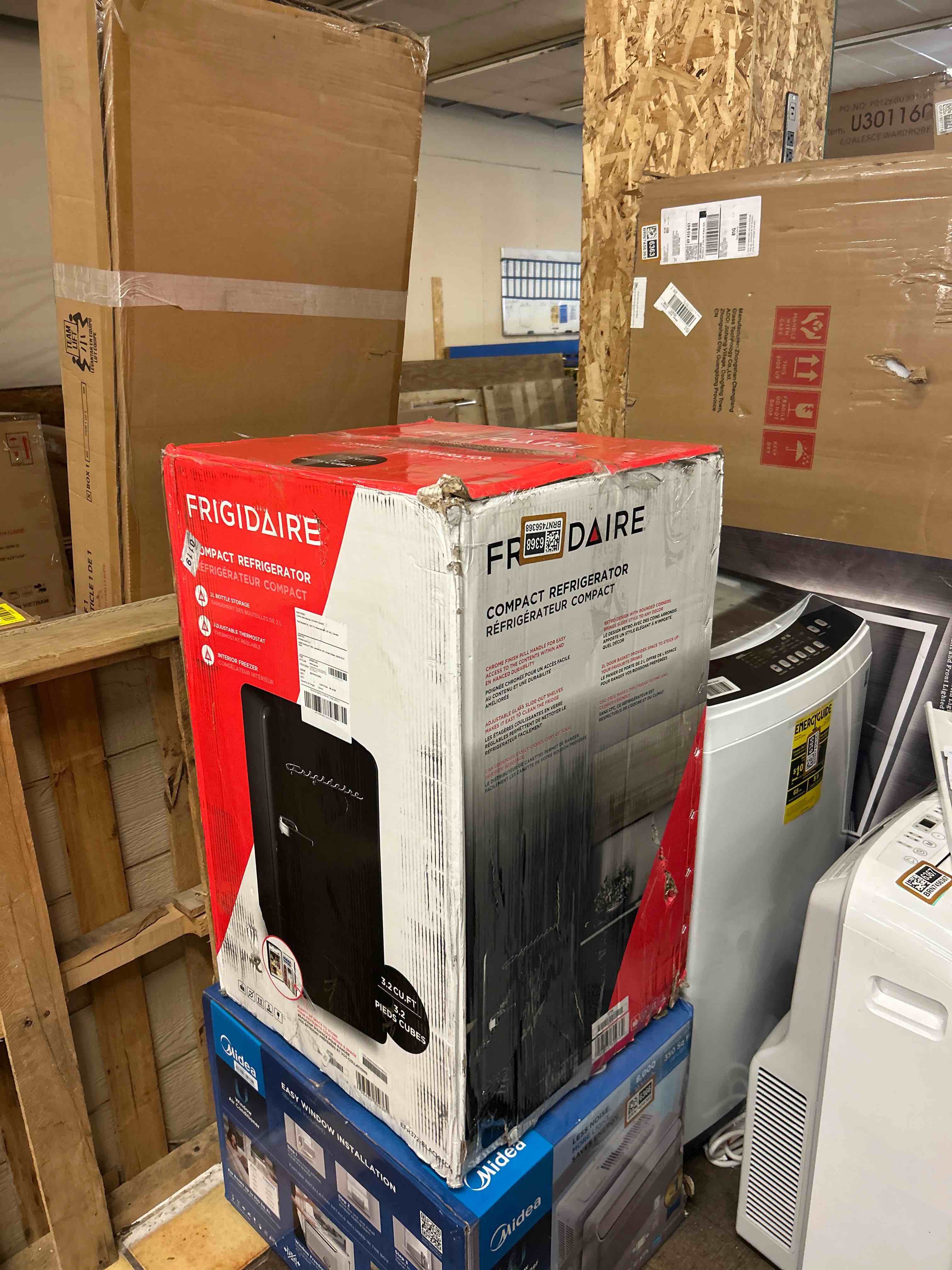 Condition photo showing New/Like New for frigidaire retro compact refrigerator with chiller, 3.2 cu ft countertop fridge, built-in bottle opener, rounded corners, premium, for office, bedroom, dorm room, cabin, 18.5d x 20w x 31.5h (black)