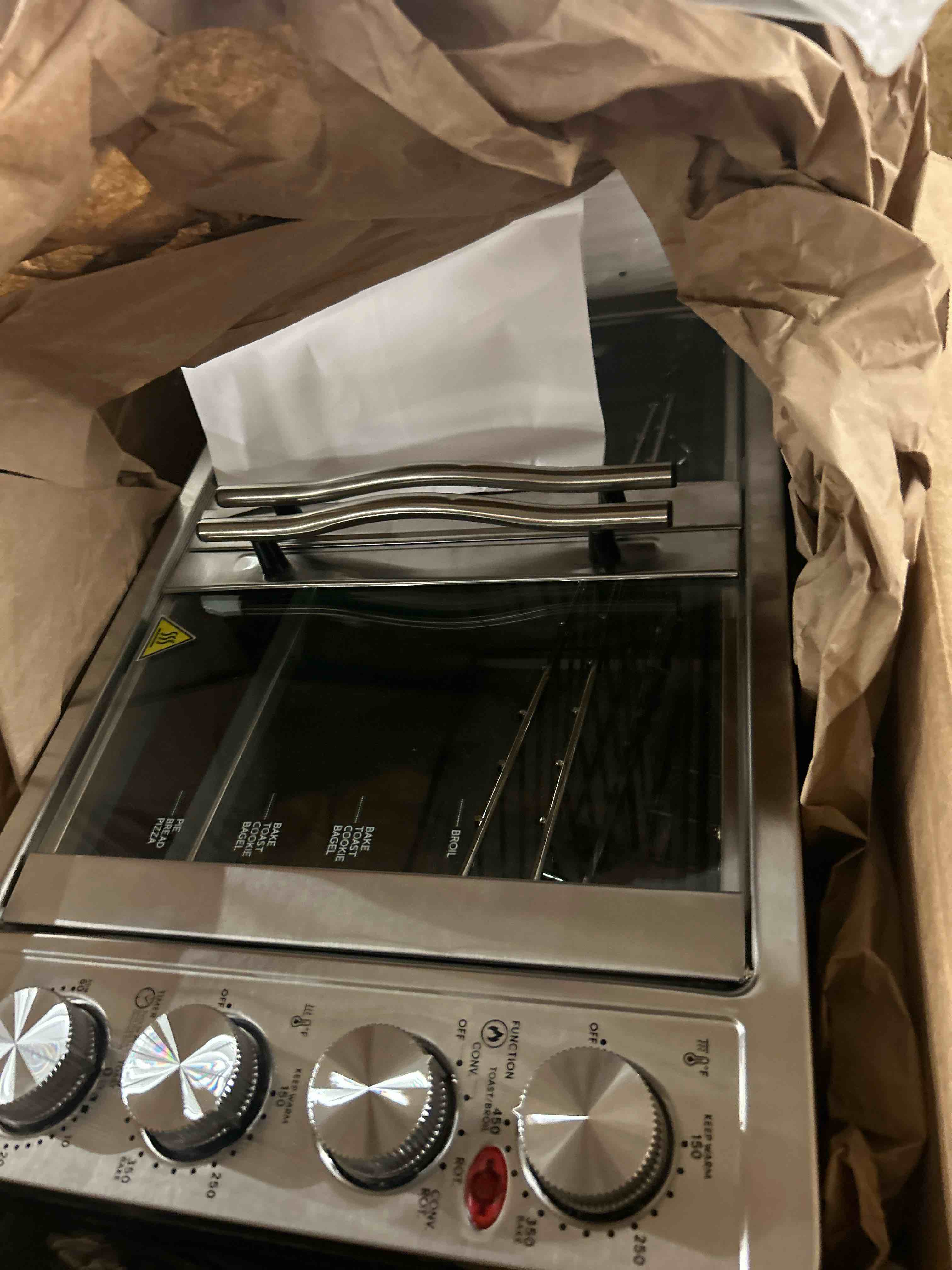 Condition photo showing New/Like New for elite gourmet eto4510mx french door 47.5qt, 18-slice convection oven 4-control knobs, bake broil toast rotisserie keep warm, includes 2 x 14" pizza racks, stainless steel