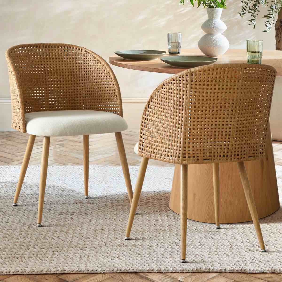 Condition photo showing New/Like New for (2) grasse rattan upholstered dining chair (set of 2)