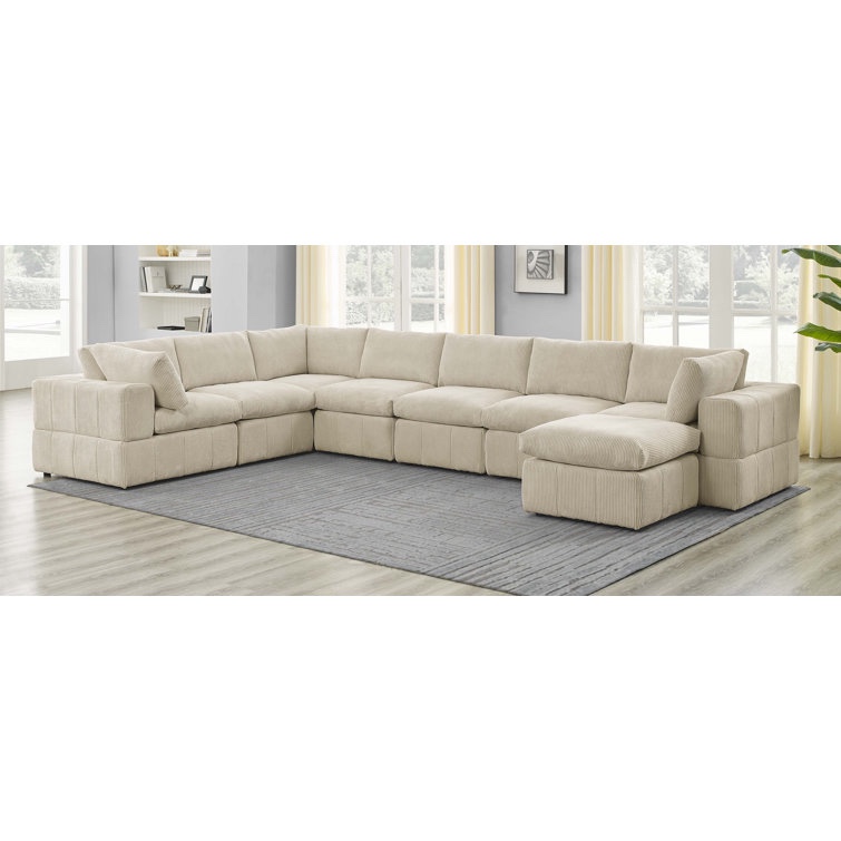Aneea 8 - Piece Corduroy Sectional in Ivory with Plastic Feet, Pillows/cushions included. Minor tears on several corners otherwise beautiful condition 