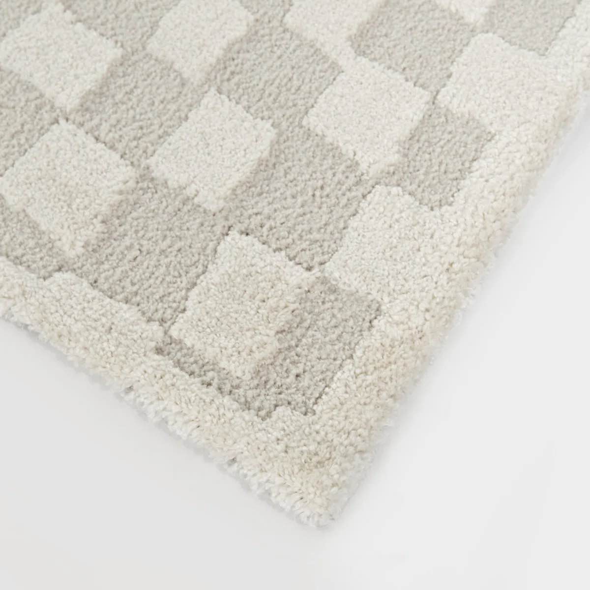 Condition photo showing New/Like New for Bingham Cream Abstract Checkered Area Rug (7ft 10 x 10)