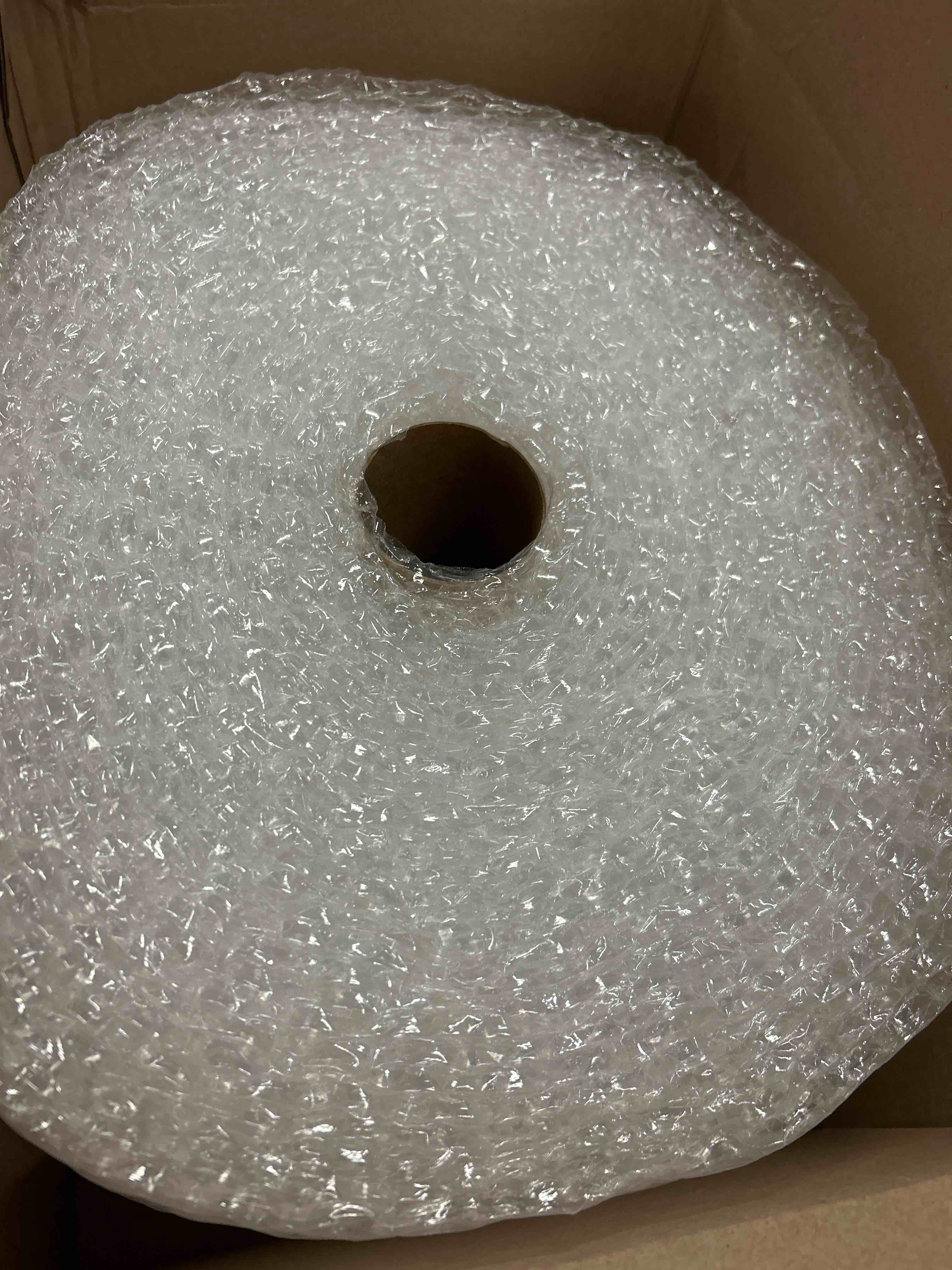 Condition photo showing New/Like New for Amazon Basics Bubble Wrap for Moving, Packing, Shipping and Storage, Perforated Protective Cushioning for Fragile Items, 12-inch x 175-ft Long Roll, Small 3/16", Clear