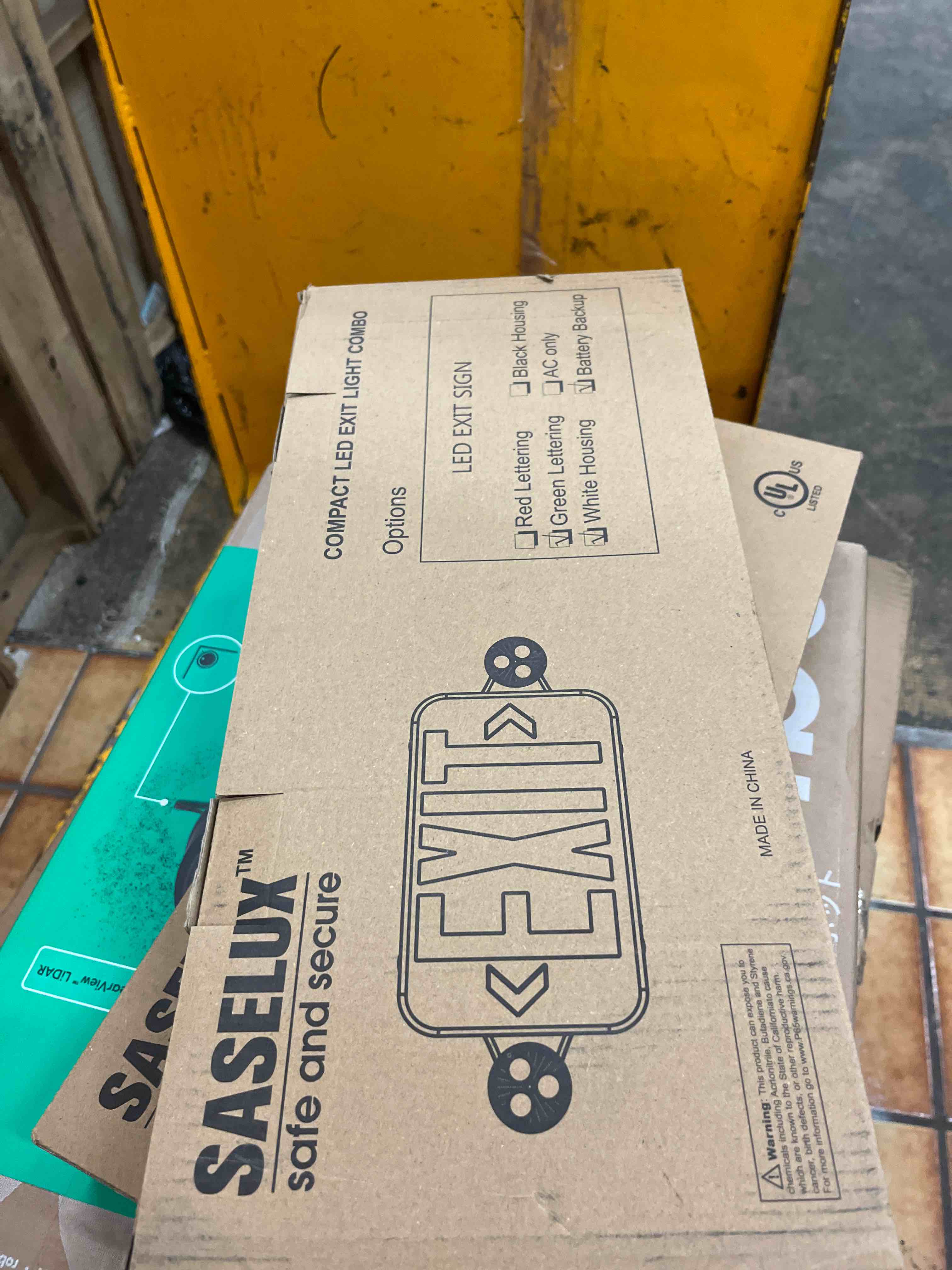 Condition photo showing New/Like New for Led Exit Sign Emergency Light Combo Adjustable Two Head,Double Sided and Battery Backup Exit Light,Green Letter Hardwired Emergency Exit Sign,AC 120/277V,UL Listed,Ceiling&Wall Mount (1 Pack)