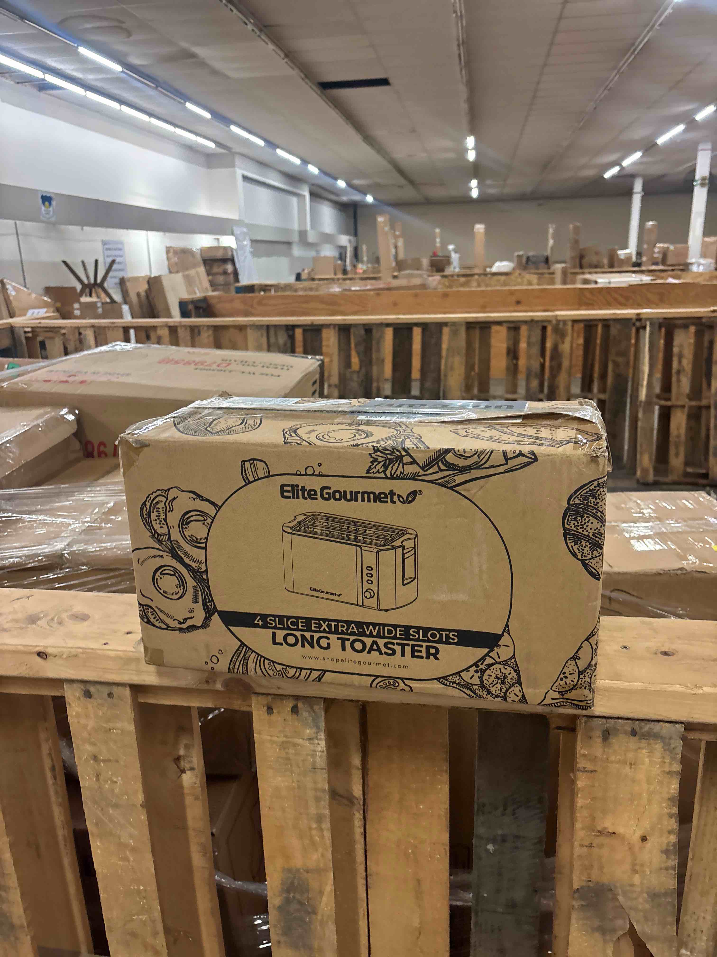 Condition photo showing New/Like New for elite gourmet ect-3100 long slot 4 slice toaster, reheat, 6 toast settings, defrost, cancel functions, built-in warming rack, extra wide slots for bagels & waffles, stainless steel & black analog stainless steel and black