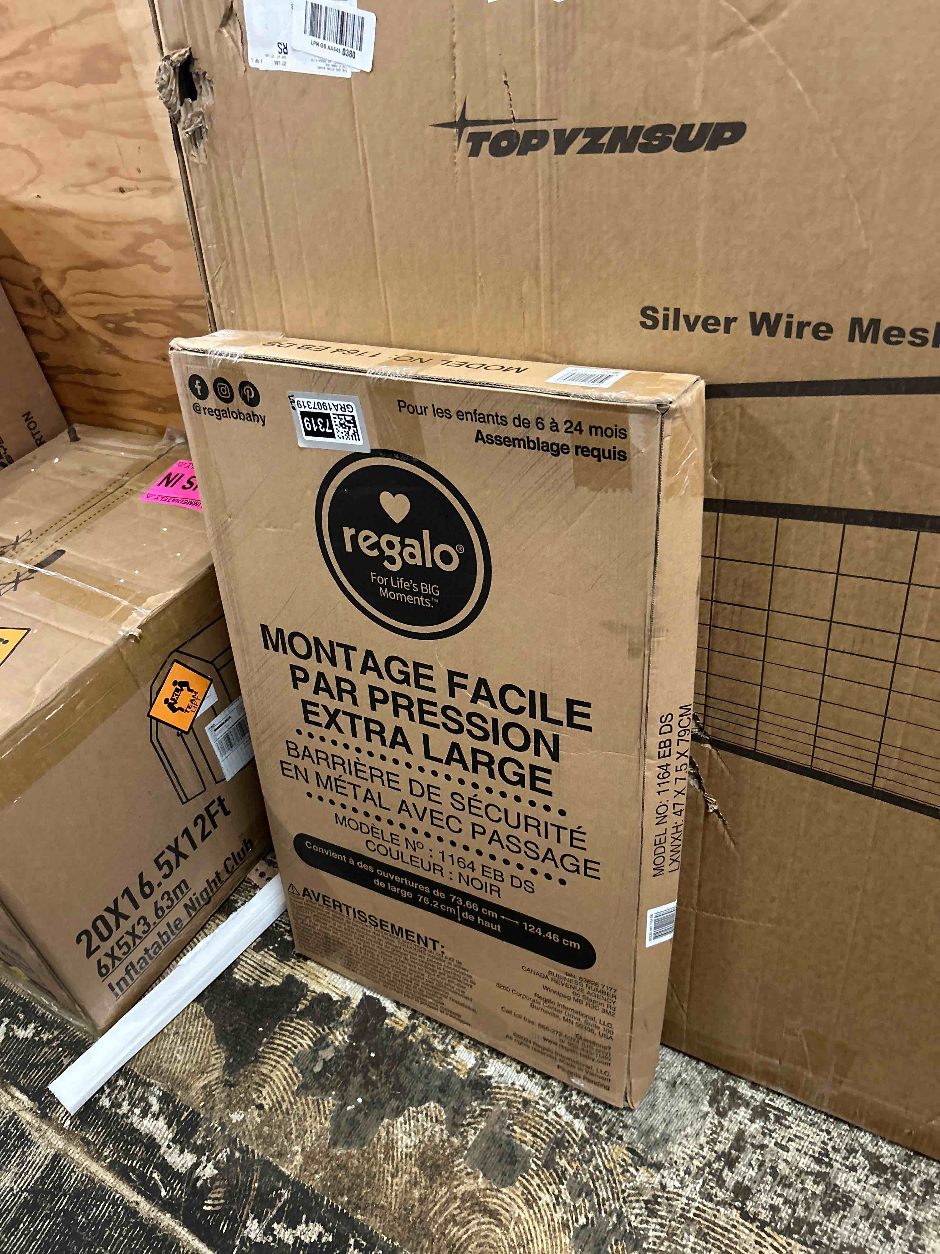 Condition photo showing New/Like New for regalo easy step 49-inch extra wide baby gate, includes 4-inch and 12-inch extension kit, 4 pack of pressure mount kit and 4 pack of wall mount kit, black