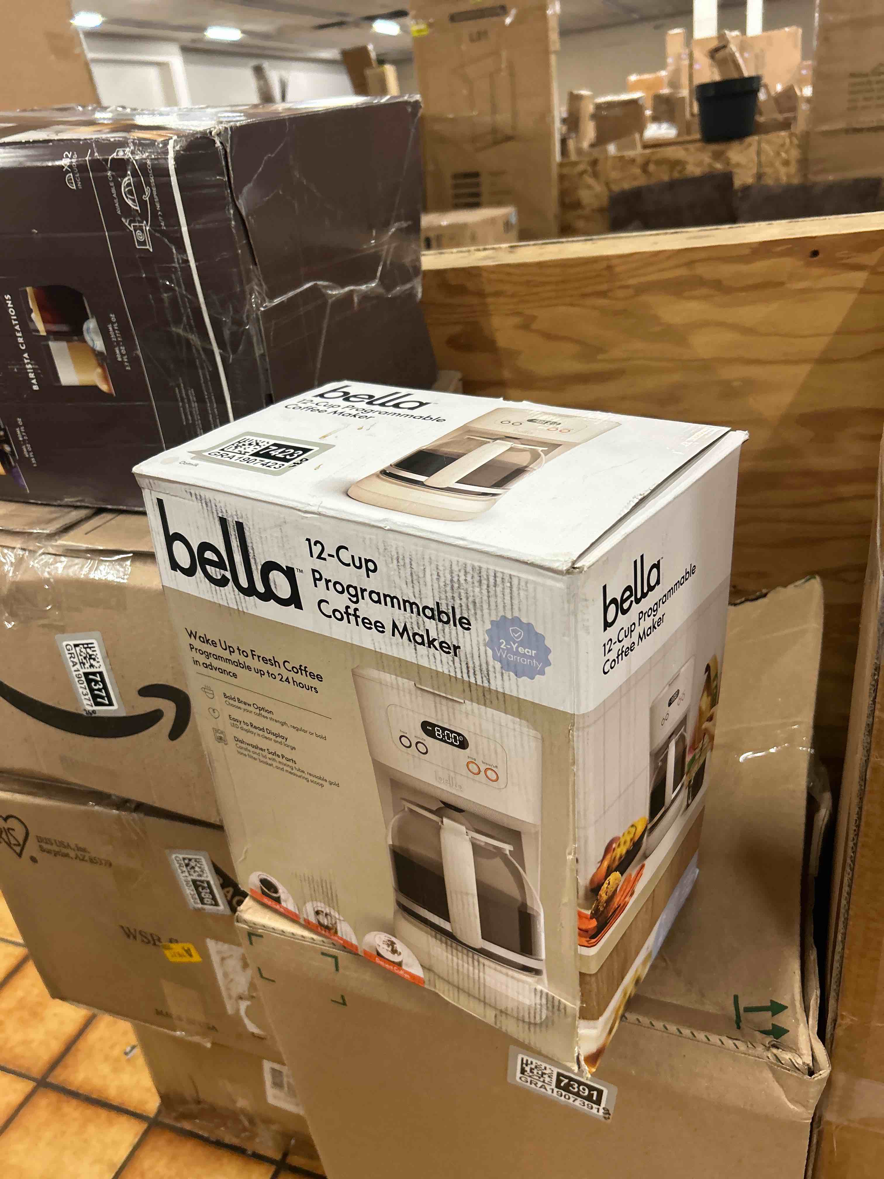 Condition photo showing New/Like New for bella 12 cup programmable coffee marker, reusable dishwasher safe accessories, easy lcd diaply, auto shutoff, 900 watt, oatmilk