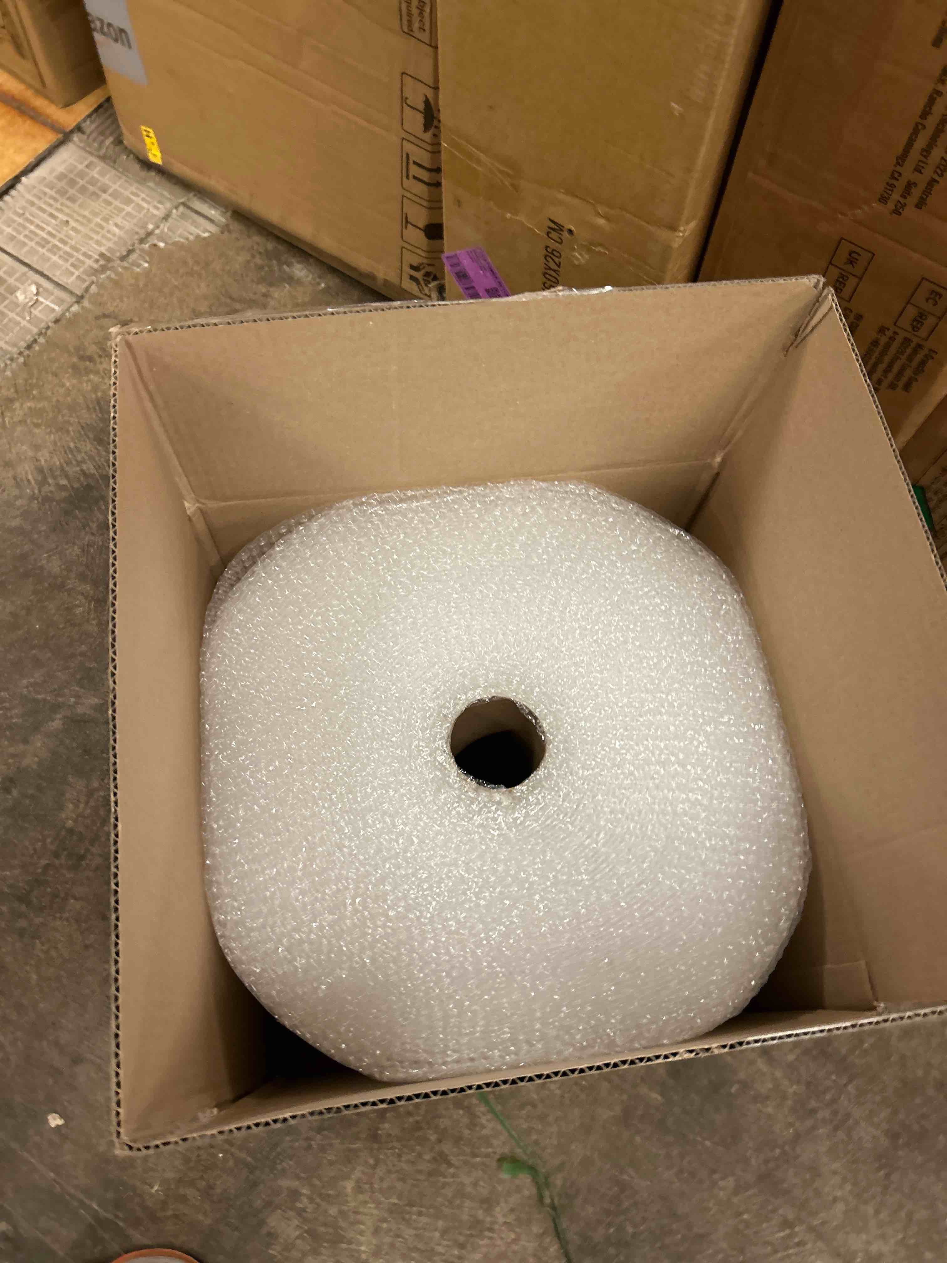 Condition photo showing New/Like New for amazon basics bubble wrap for moving, packing, shipping and storage, perforated protective cushioning for fragile items, 12-inch x 175-ft long roll, small 3/16", clear
